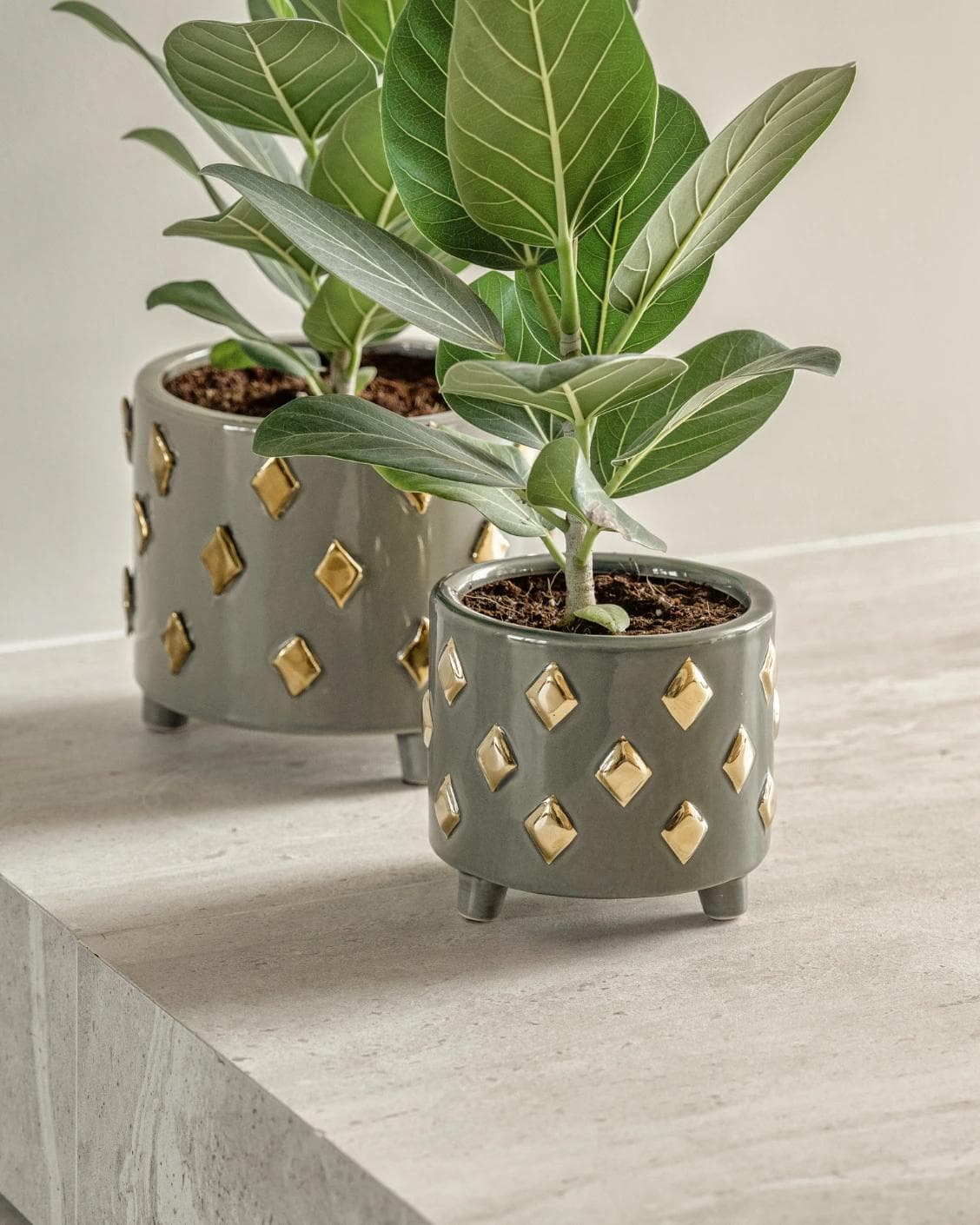 Caspian Arneson Bundle vases in grey and gold, shown in a lifestyle right view as image 7