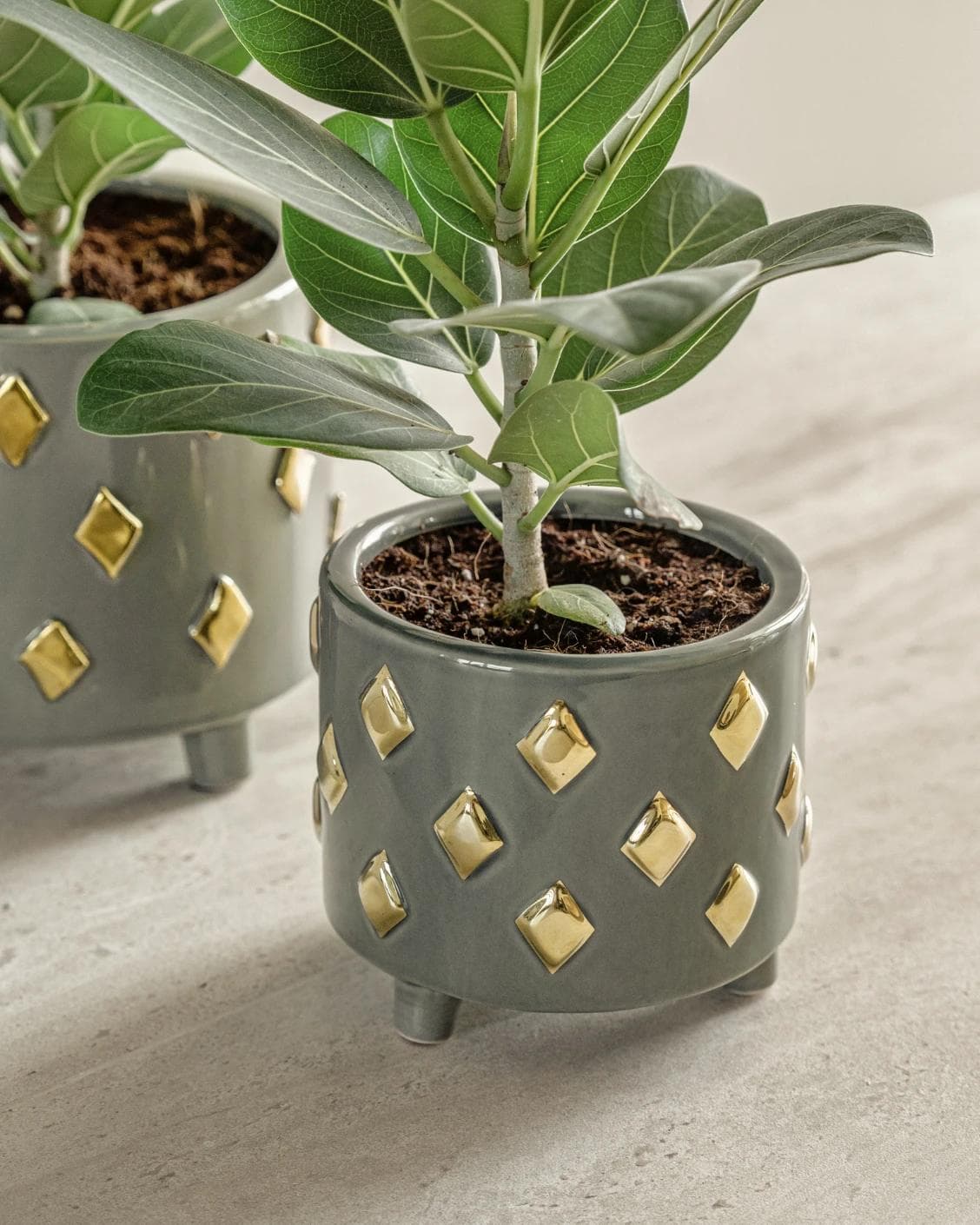 Caspian Arneson Bundle vases in grey and gold, shown in a lifestyle right view as image 8