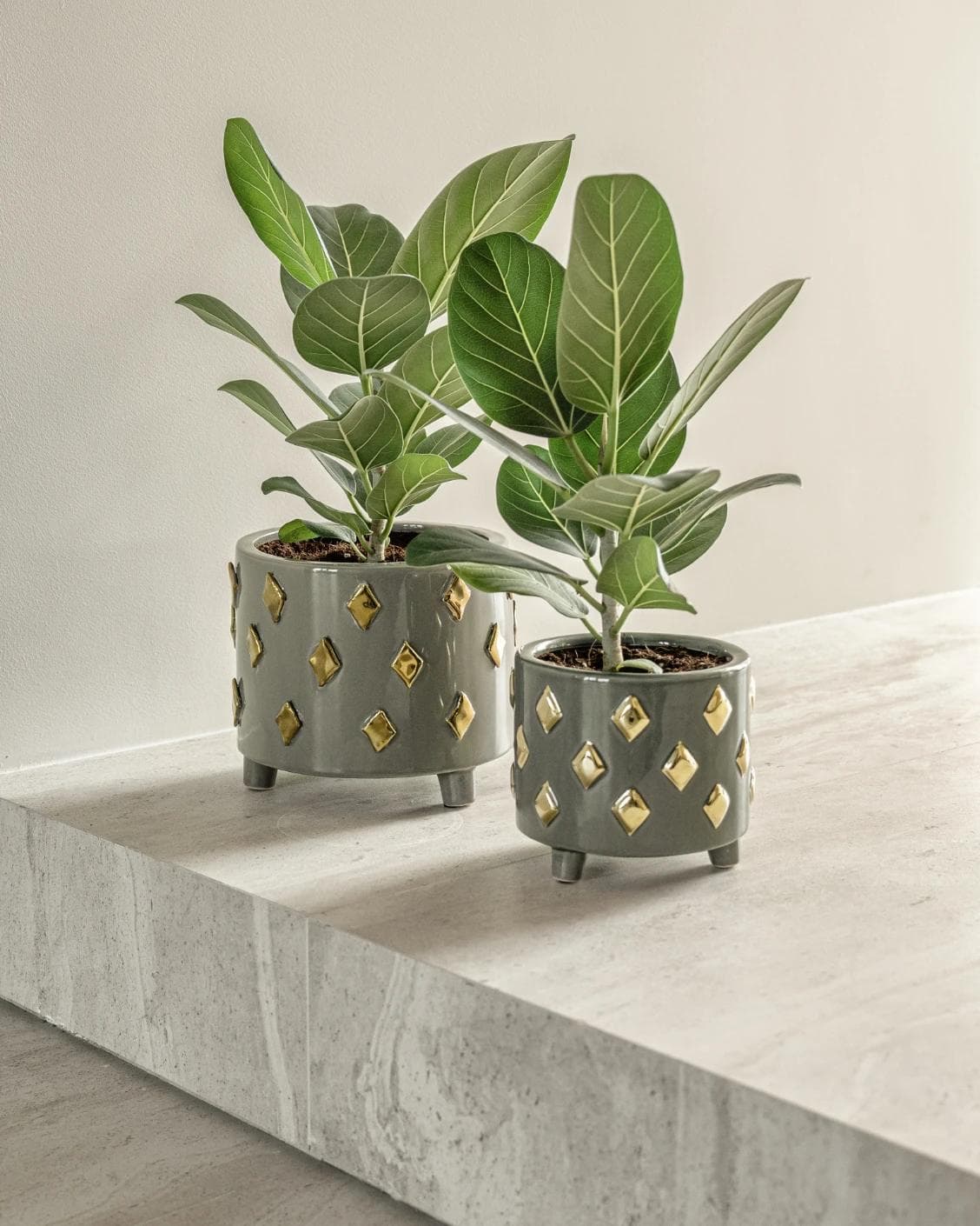 Caspian Arneson Bundle vases in grey and gold, shown in a lifestyle right view as image 2