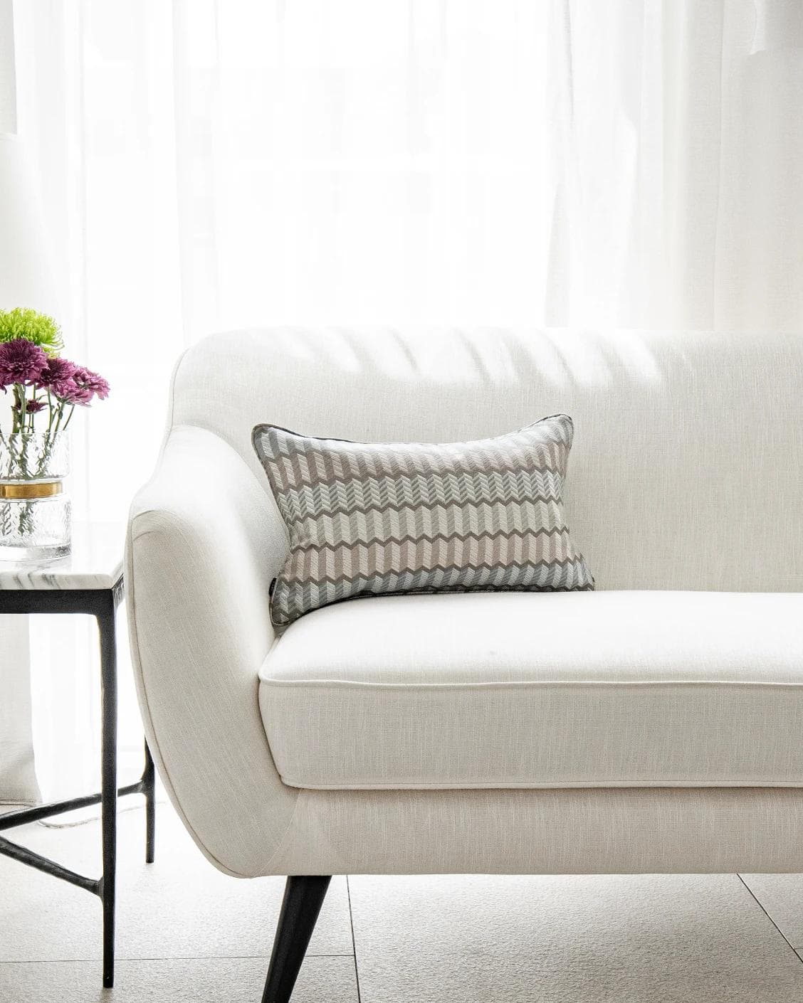Cecilia Canova II cushion in silver, blue and multicolour, shown in a lifestyle front view as image 1