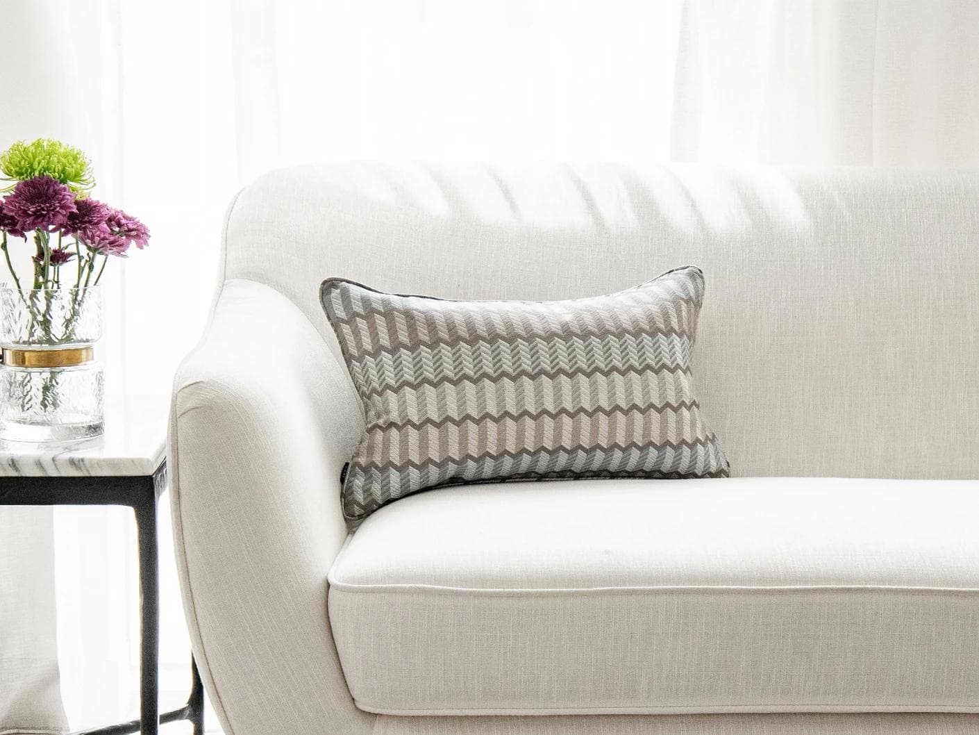 Cecilia Canova II cushion in silver, blue and multicolour, shown in a lifestyle front view as image 1