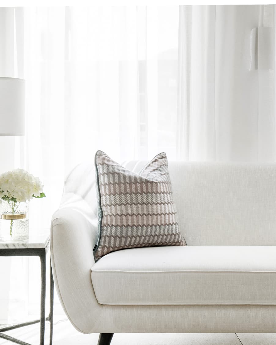 Cecilia Canova cushion in silver, blue and multicolour, shown in a lifestyle left view as image 1