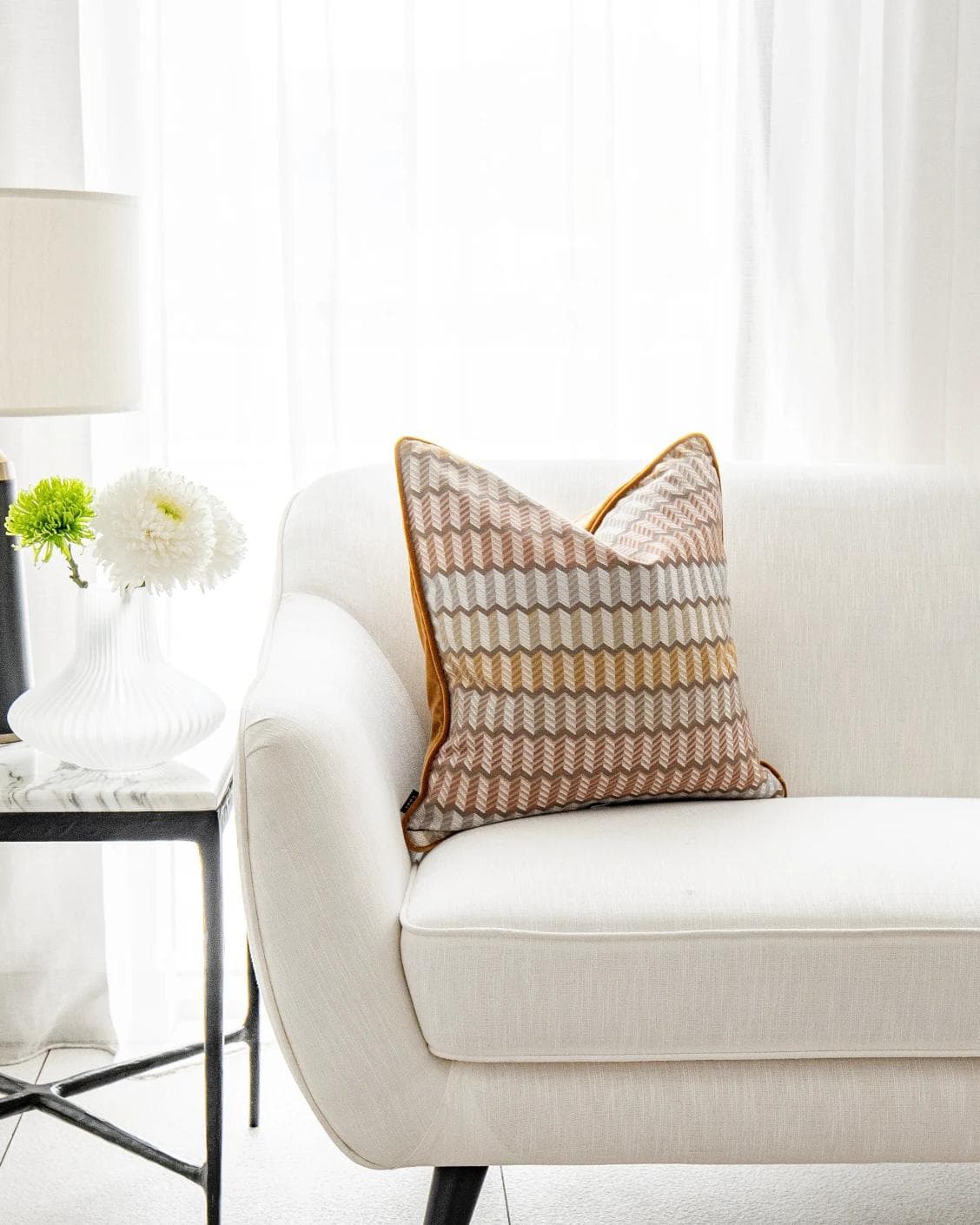Cecilia Hodler cushion in orange, yellow and multicolour, shown in a lifestyle front view as image 4