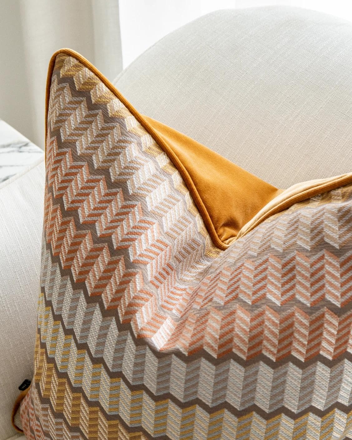 Cecilia Hodler cushion in orange, yellow and multicolour, shown in a lifestyle top view as image 6