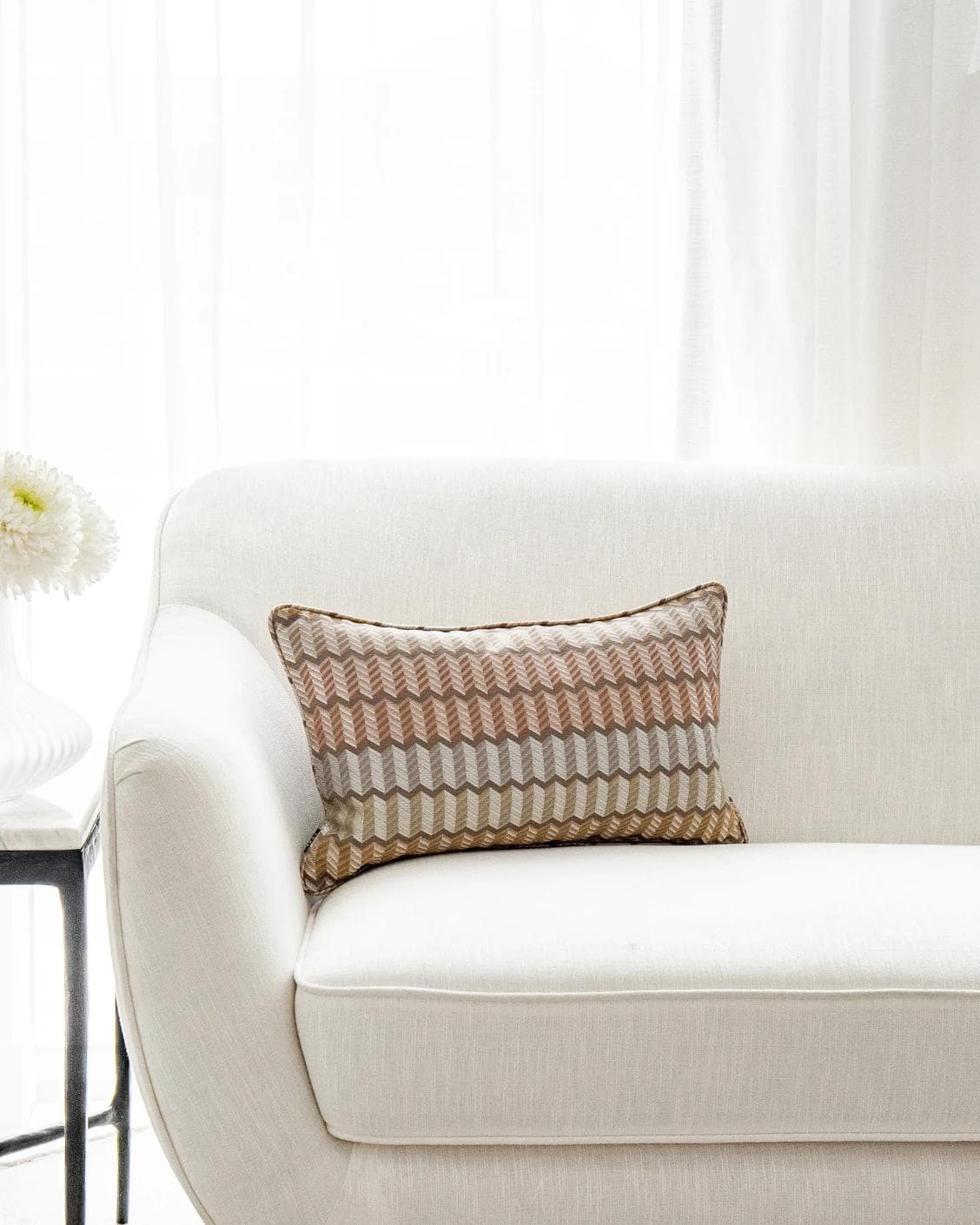 Cecilia Hodler II cushion in orange, yellow and multicolour, shown in a lifestyle front view as image 1