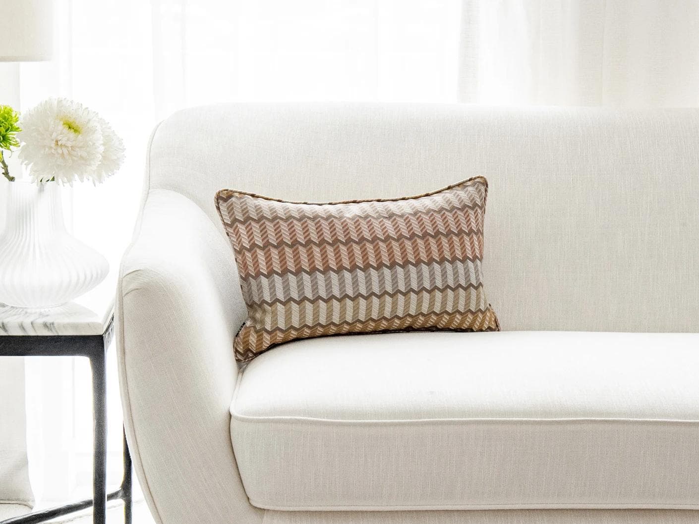 Cecilia Hodler II cushion in orange, yellow and multicolour, shown in a lifestyle front view as image 1