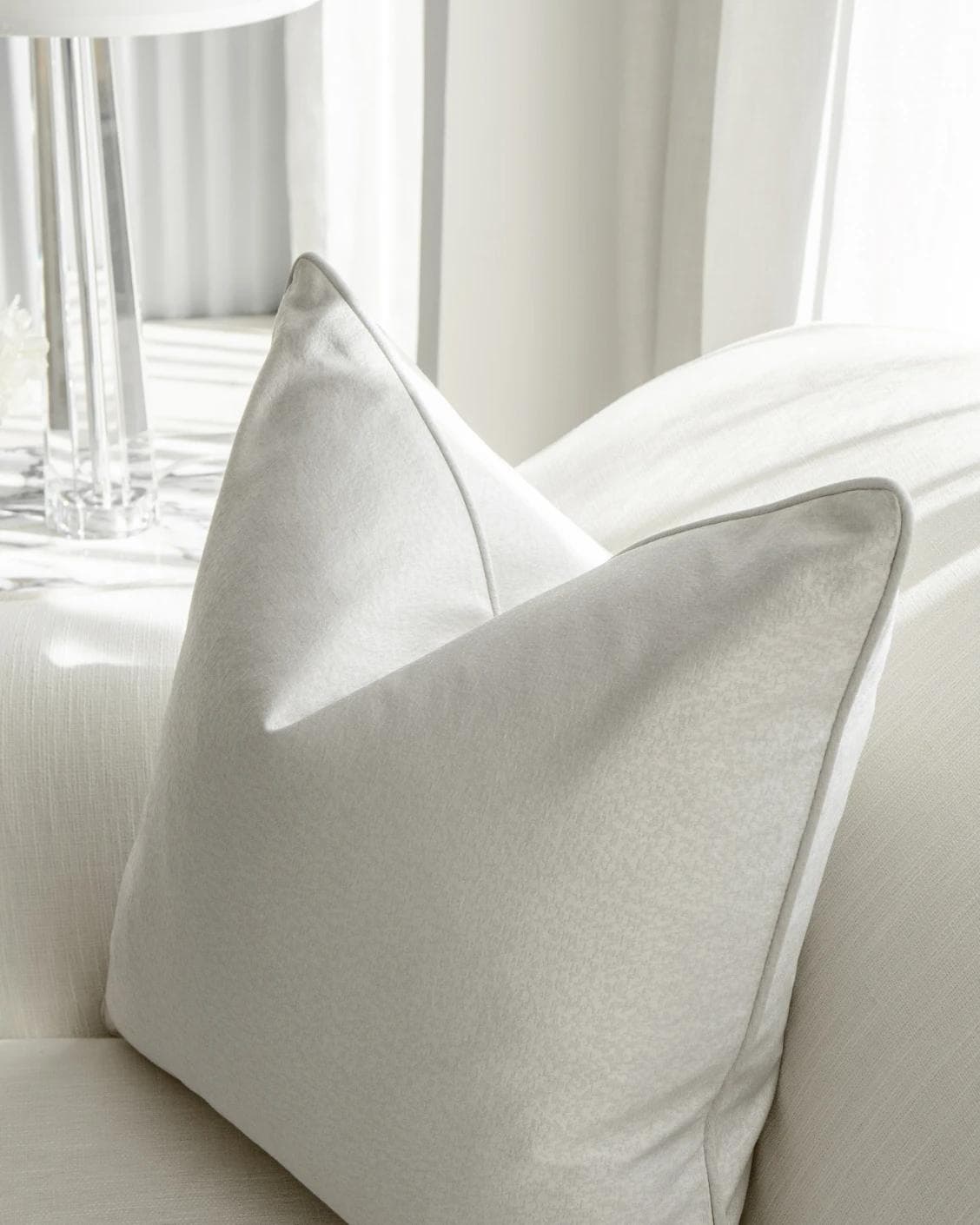 Celeste Hodler cushion in silver, shown in a lifestyle right view as image 7