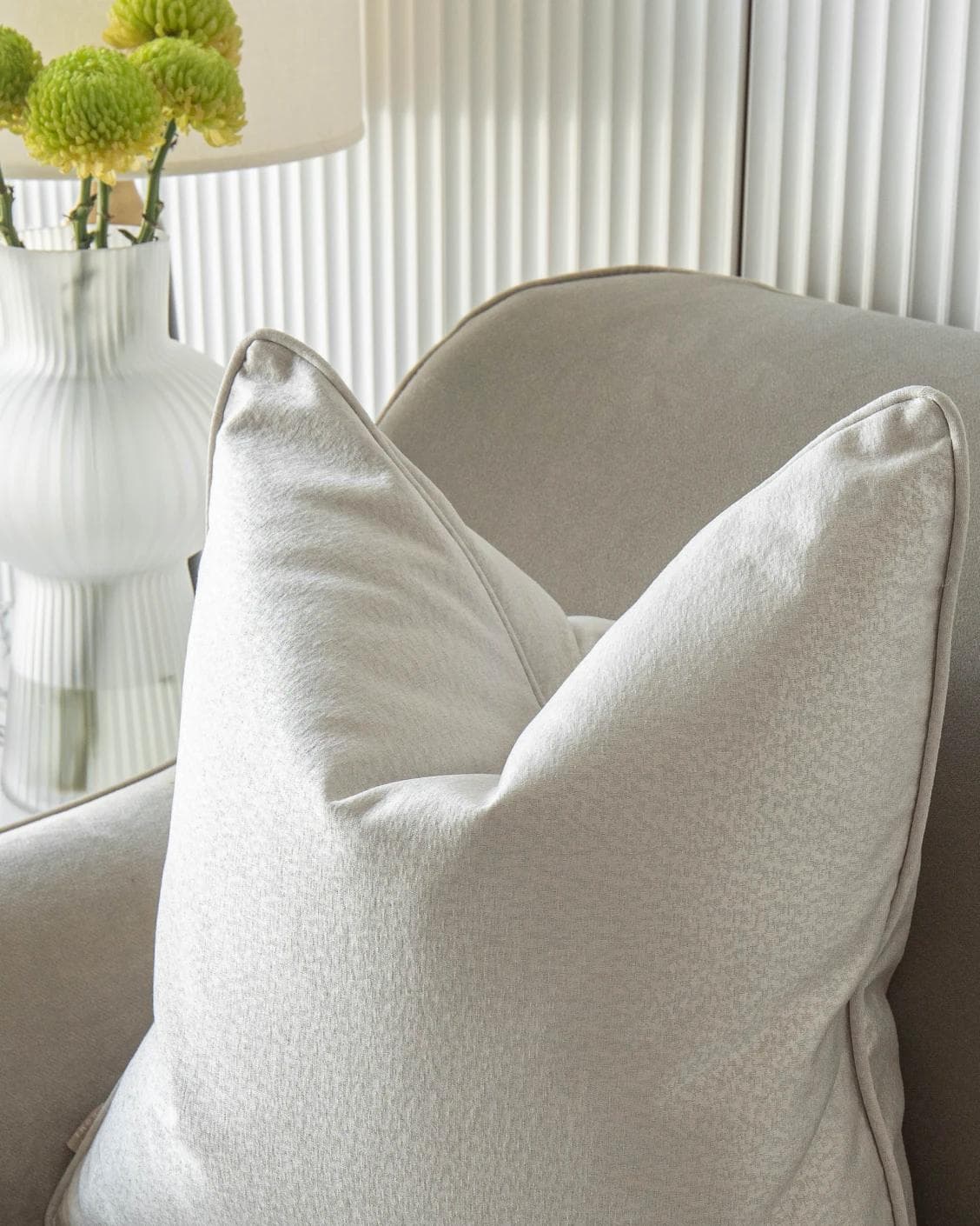 Celeste Hodler cushion in silver, shown in a lifestyle top view as image 8