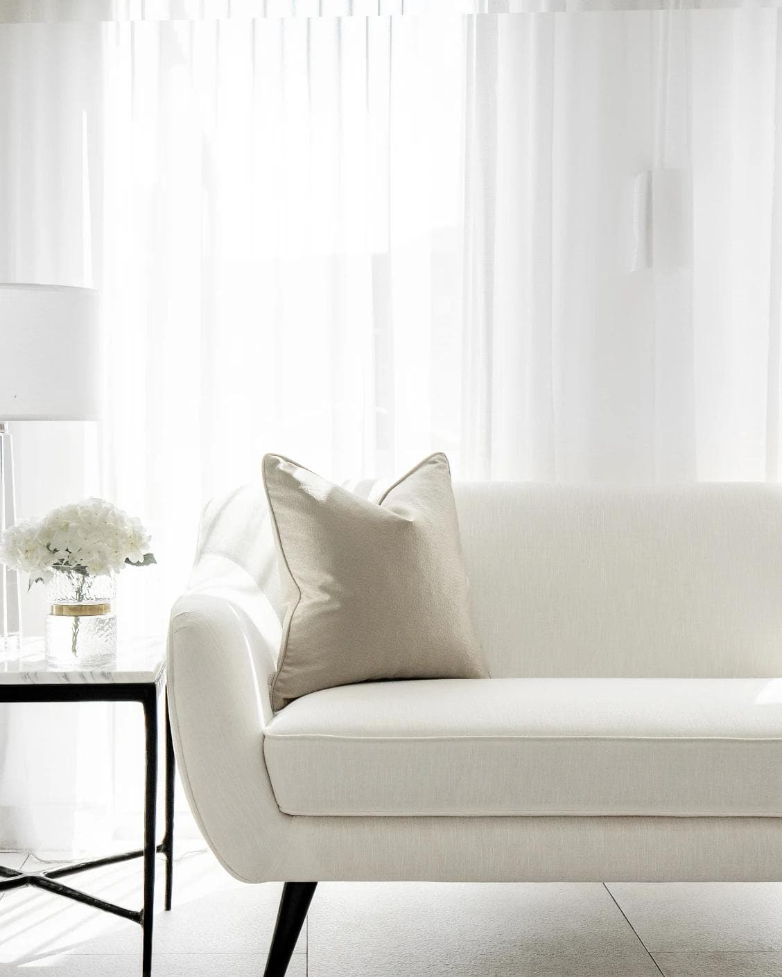 Celeste Laurent cushion in gold and beige, shown in a lifestyle front view as image 4