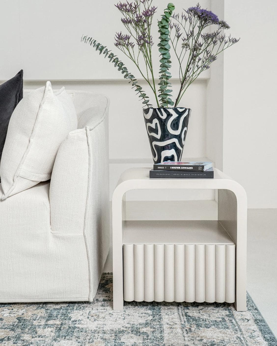 Celia nightstand in soft ivory and stone, shown in a lifestyle front view as image 2