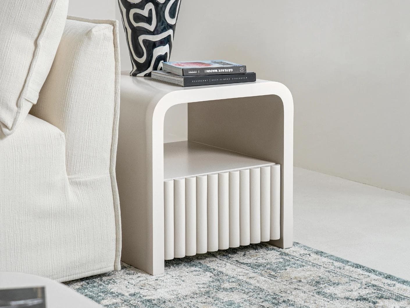Celia nightstand in soft ivory and stone, shown in a lifestyle left view as image 4