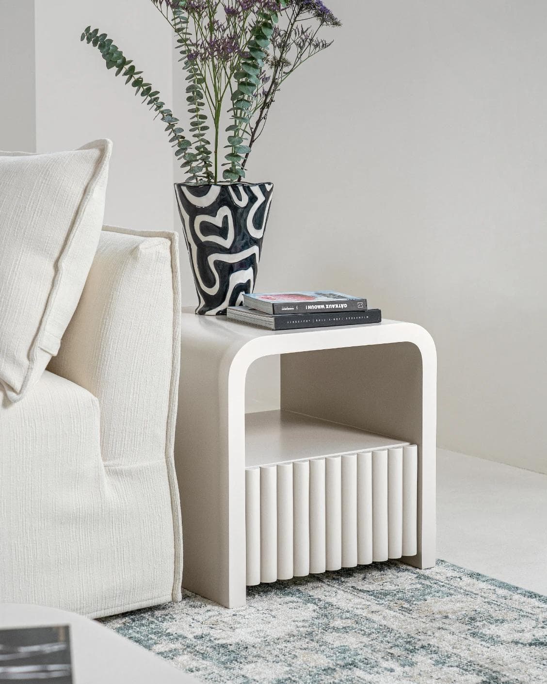 Celia nightstand in soft ivory and stone, shown in a lifestyle left view as image 4