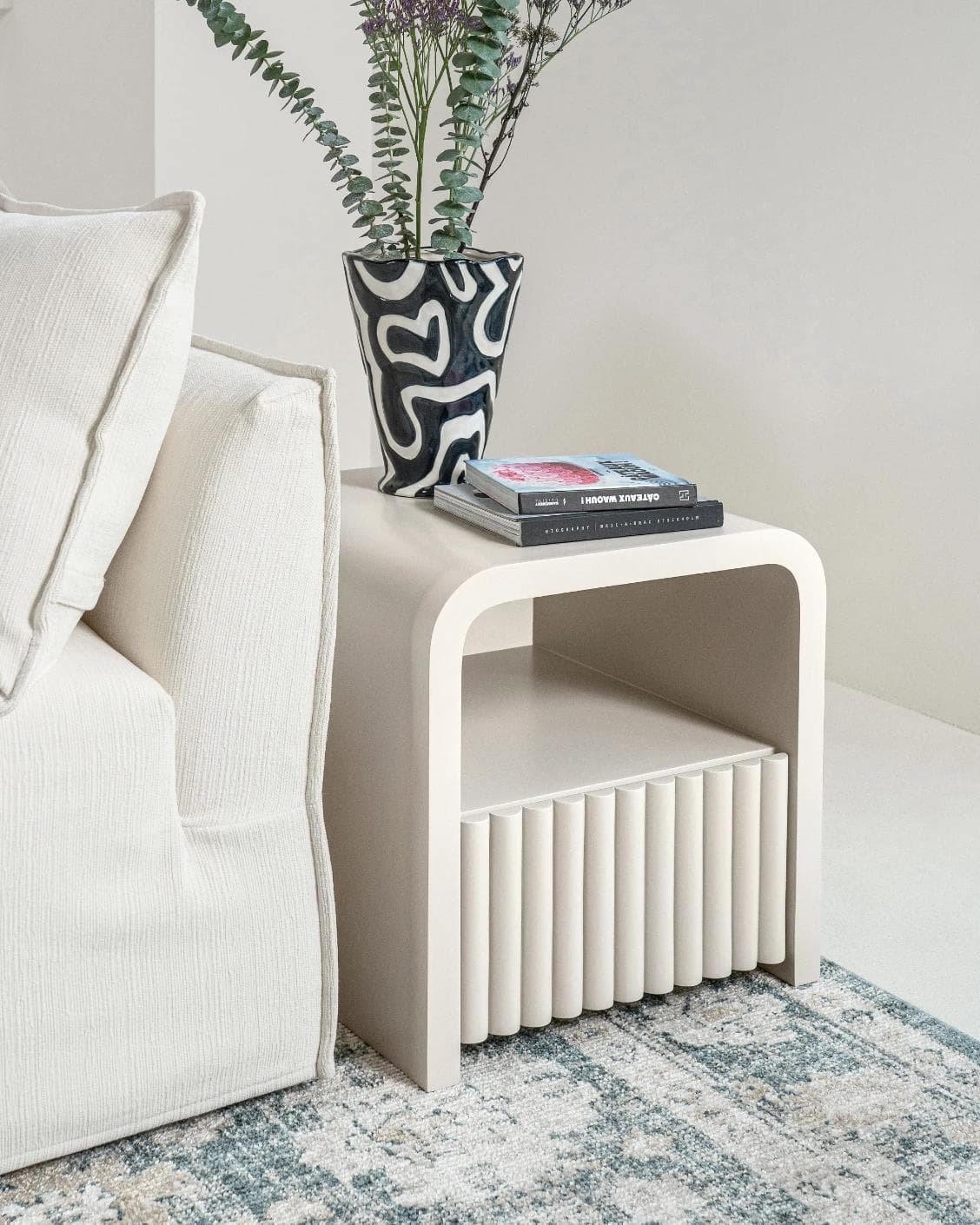 Celia nightstand in soft ivory and stone, shown in a lifestyle left view as image 5