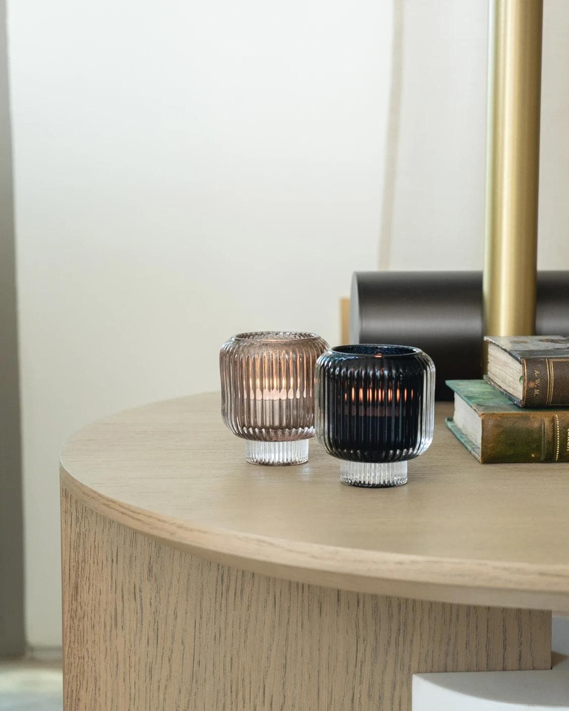 Chandelle Storms candle holders in black and taupe, shown in a lifestyle right view as image 2