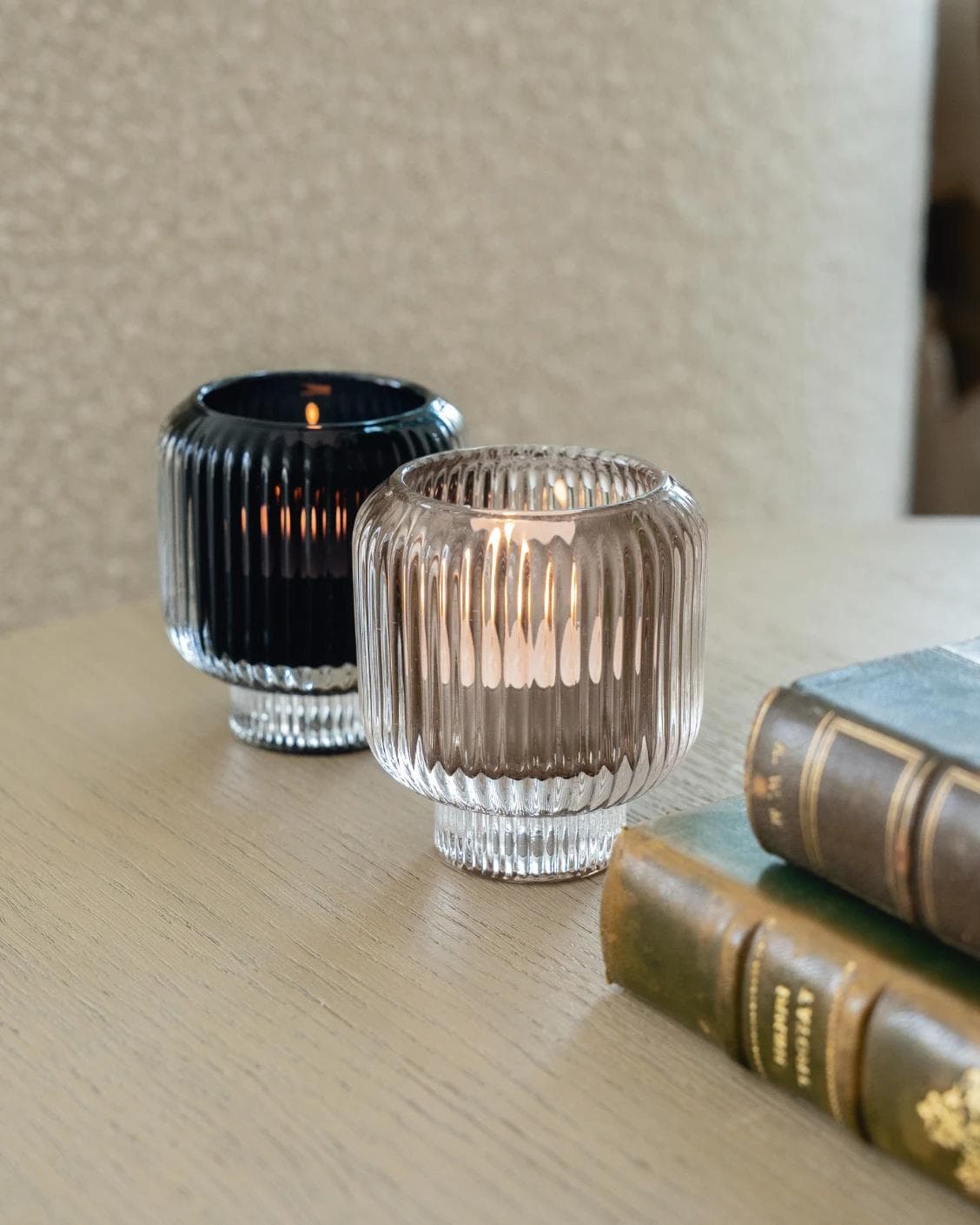 Chandelle Storms candle holders in black and taupe, shown in a lifestyle right view as image 4
