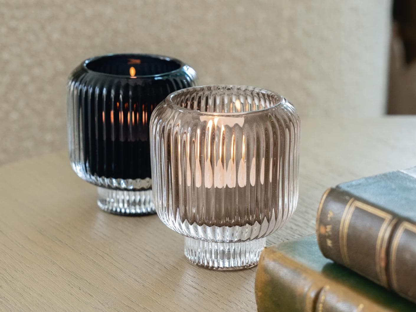 Chandelle Storms candle holders in black and taupe, shown in a lifestyle right view as image 4