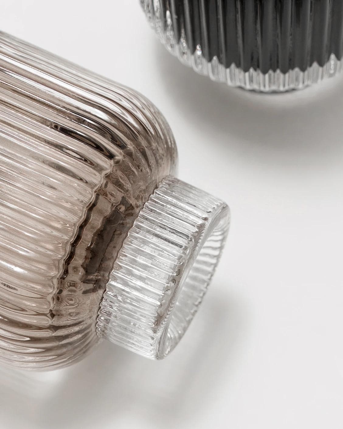 Chandelle Storms candle holders in black and taupe, shown in a product close-up as image 7
