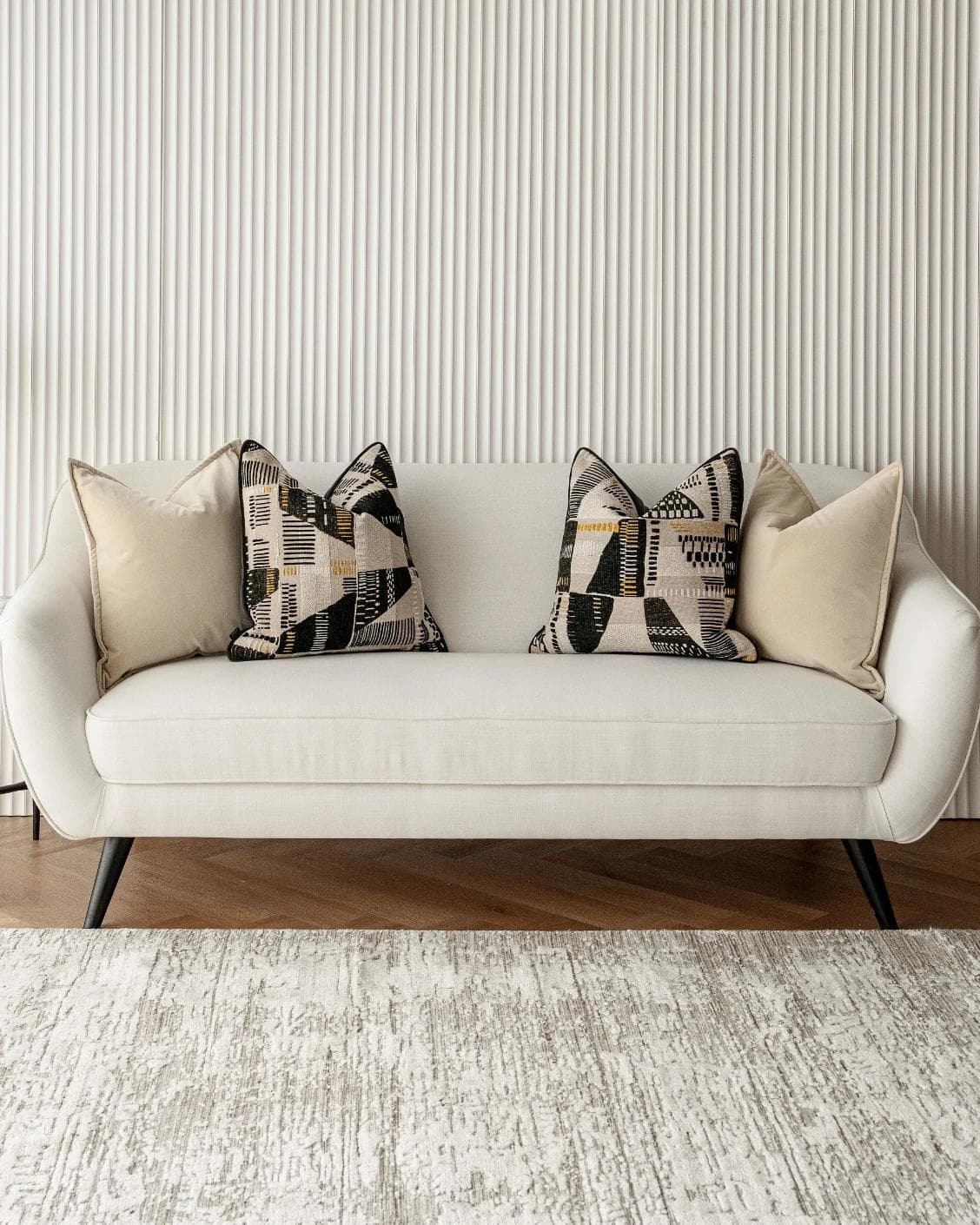 Charna Bundle cushion in beige, shown in a lifestyle front view as image 4