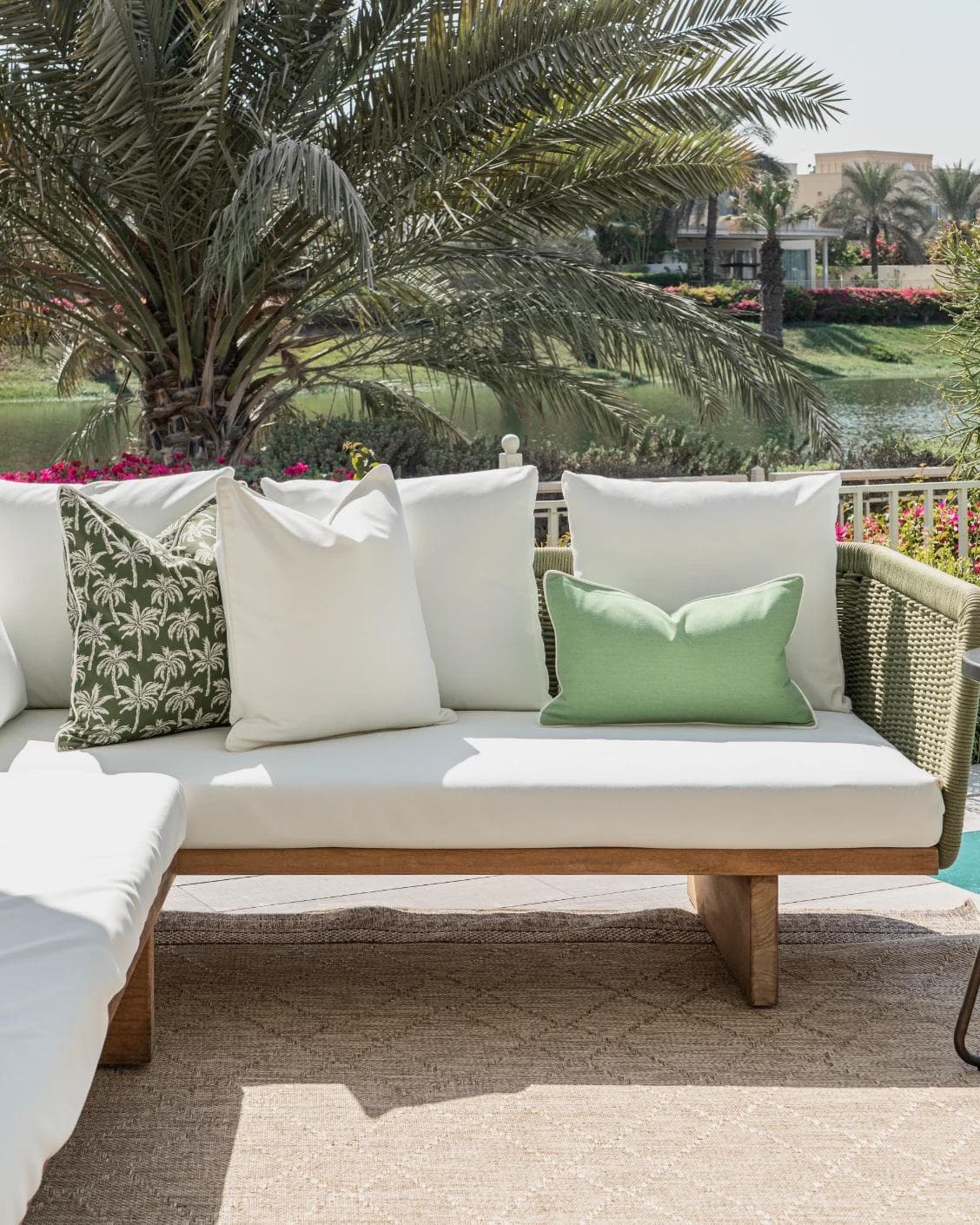 Chaya Bundle cushion in green and ivory, shown in a lifestyle front view as image 4