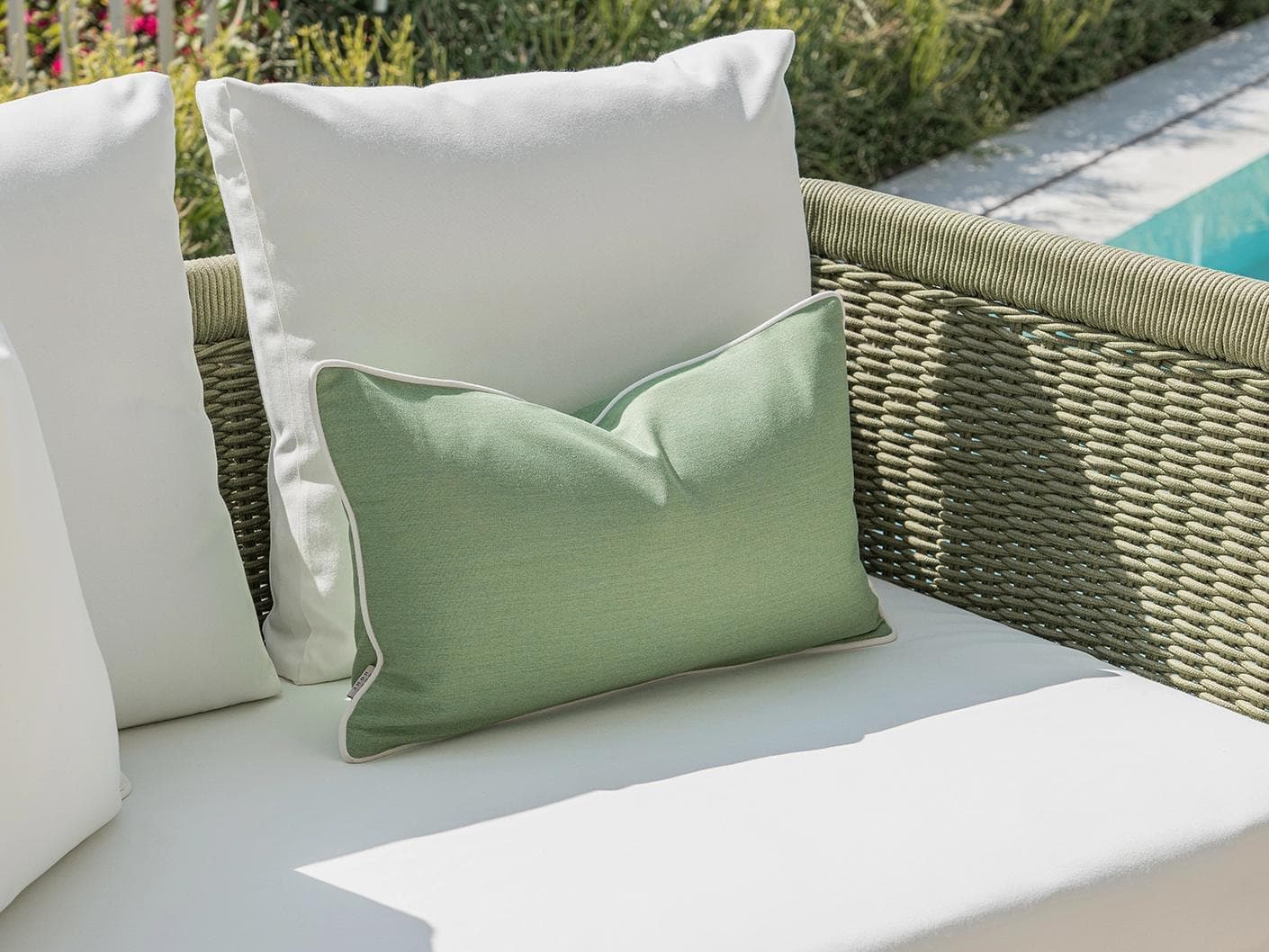 Chaya Bundle cushion in green and ivory, shown in a lifestyle left view as image 5