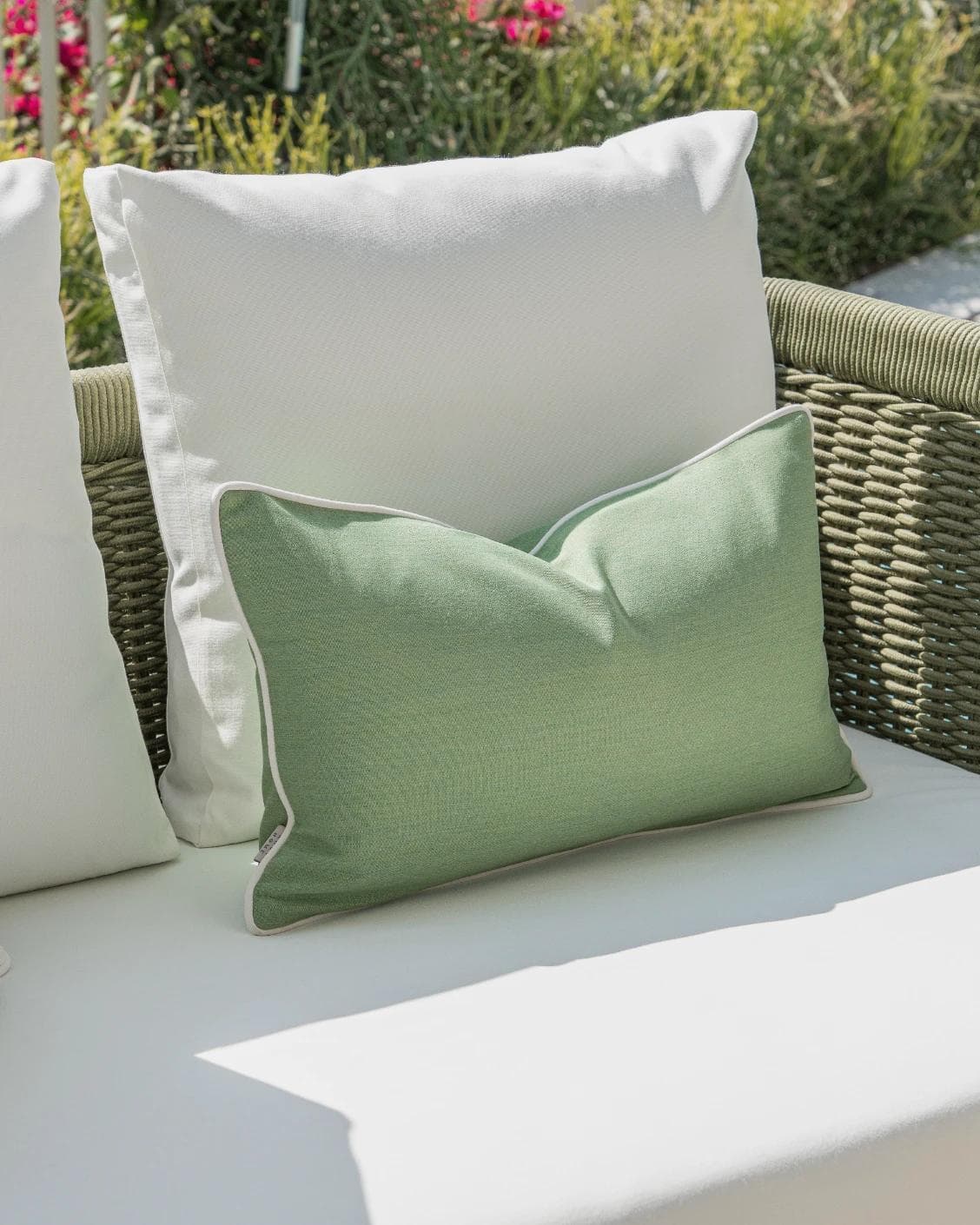 Chaya Bundle cushion in green and ivory, shown in a lifestyle left view as image 5