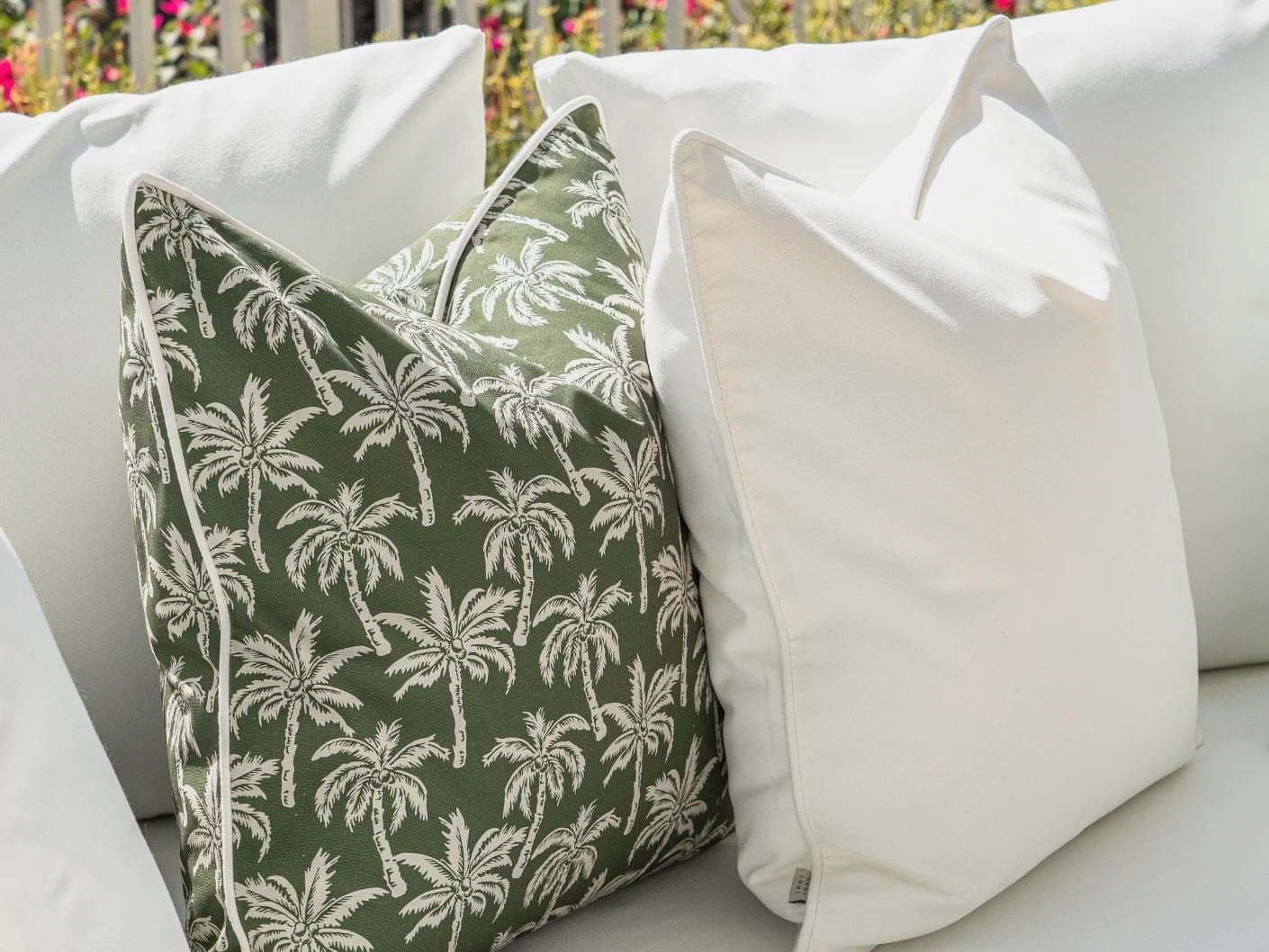 Chaya Bundle cushion in green and ivory, shown in a lifestyle left view as image 6