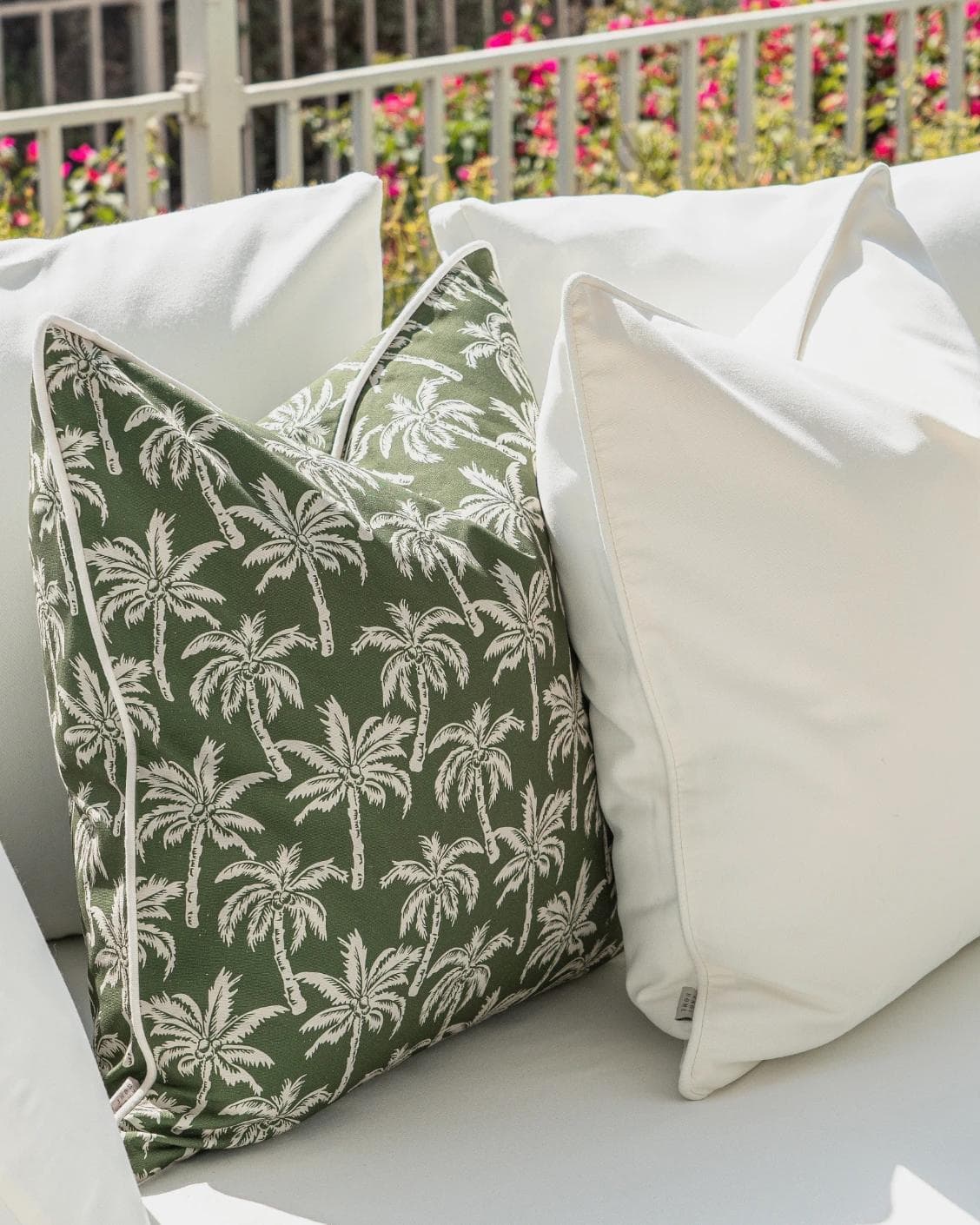 Chaya Bundle cushion in green and ivory, shown in a lifestyle left view as image 6