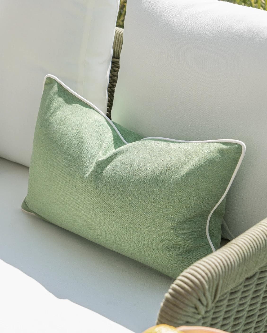 Chaya Bundle cushion in green and ivory, shown in a lifestyle right view as image 7