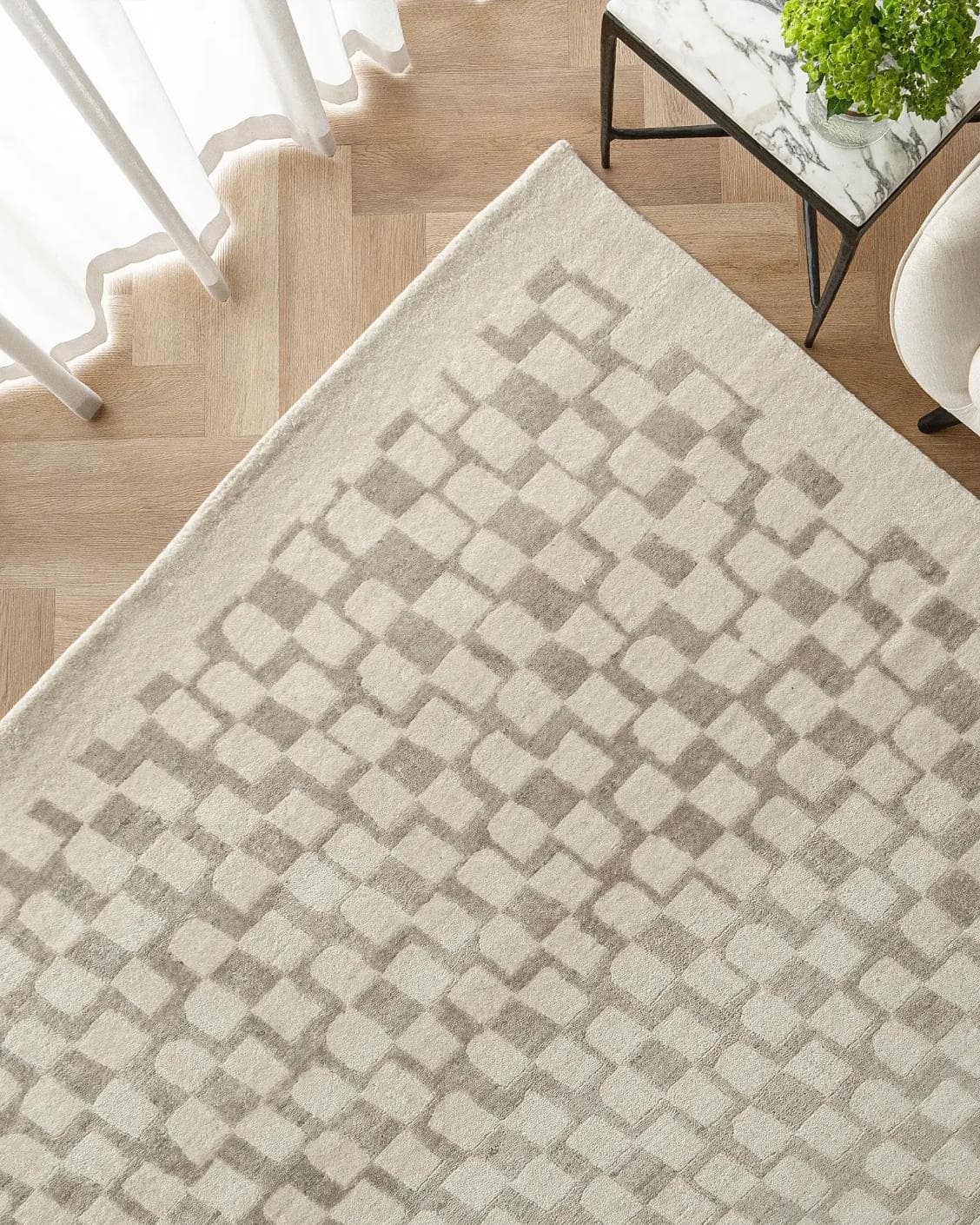 Chess Dune carpet in taupe and beige, shown in a lifestyle top view as image 2