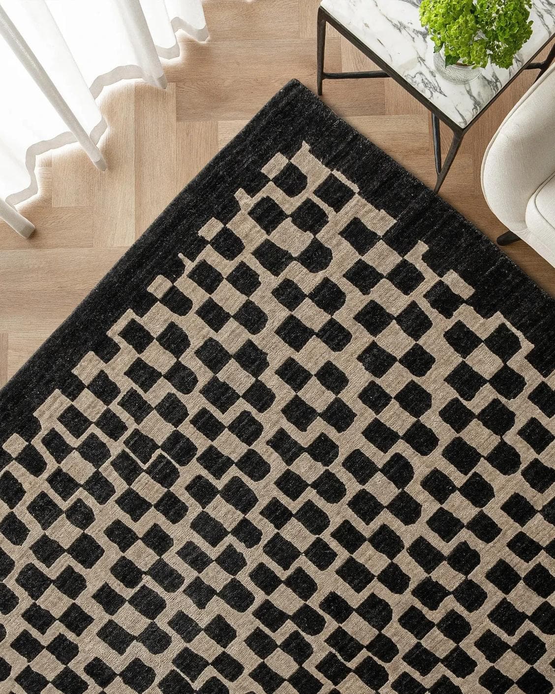 Chess Ebony carpet in beige and black, shown in a lifestyle top view as image 2