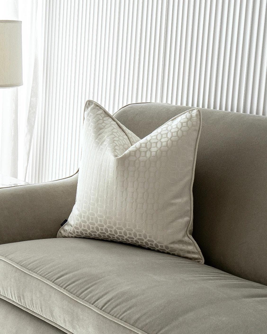 Cillian Bianca cushion in white, shown in a lifestyle front view as image 2