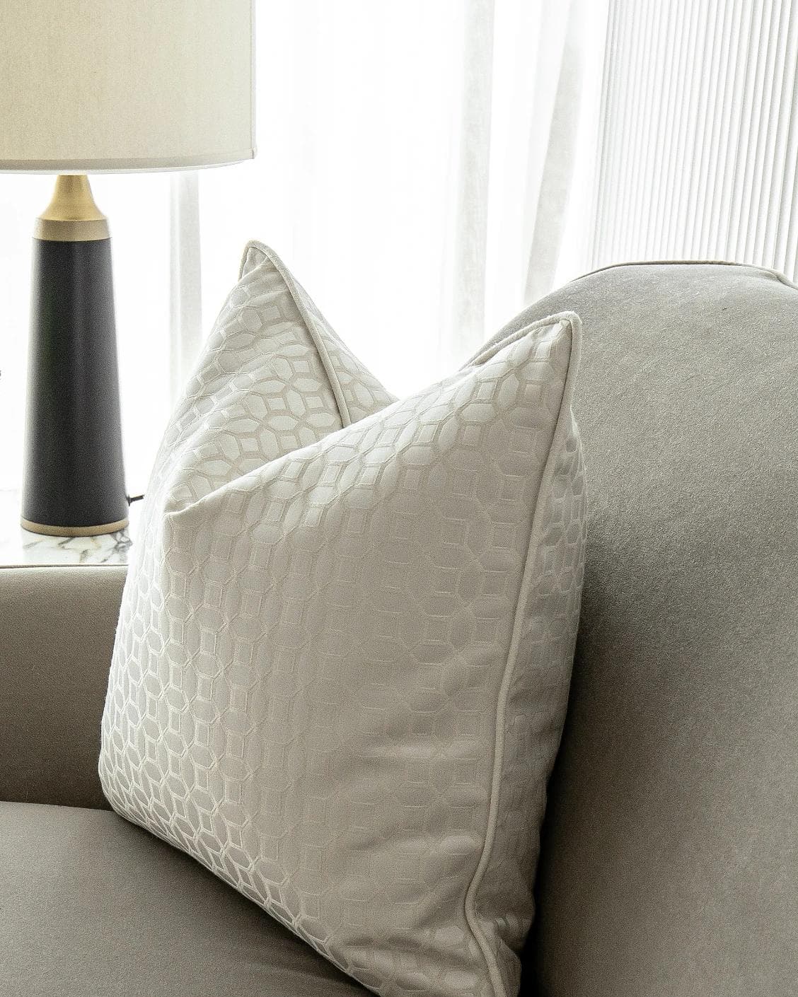 Cillian Bianca cushion in white, shown in a lifestyle right view as image 5