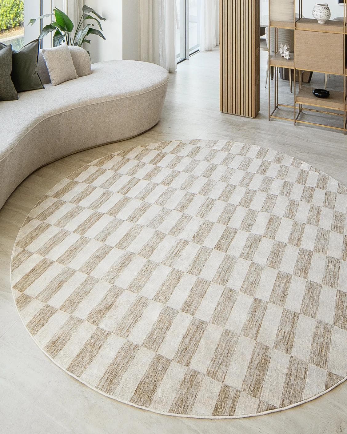 Cindy Tan Round carpet in taupe and beige, shown in a lifestyle front view