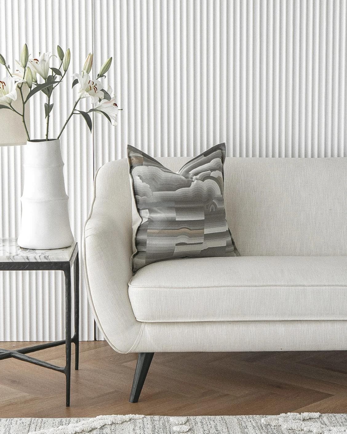 Claudine Laurent cushion in grey, shown in a lifestyle front view as image 4