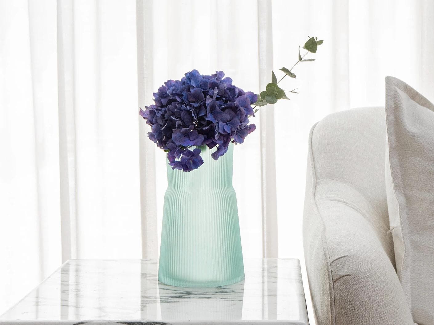 Cloris Storms vases in turquoise, shown in a lifestyle front view as image 4
