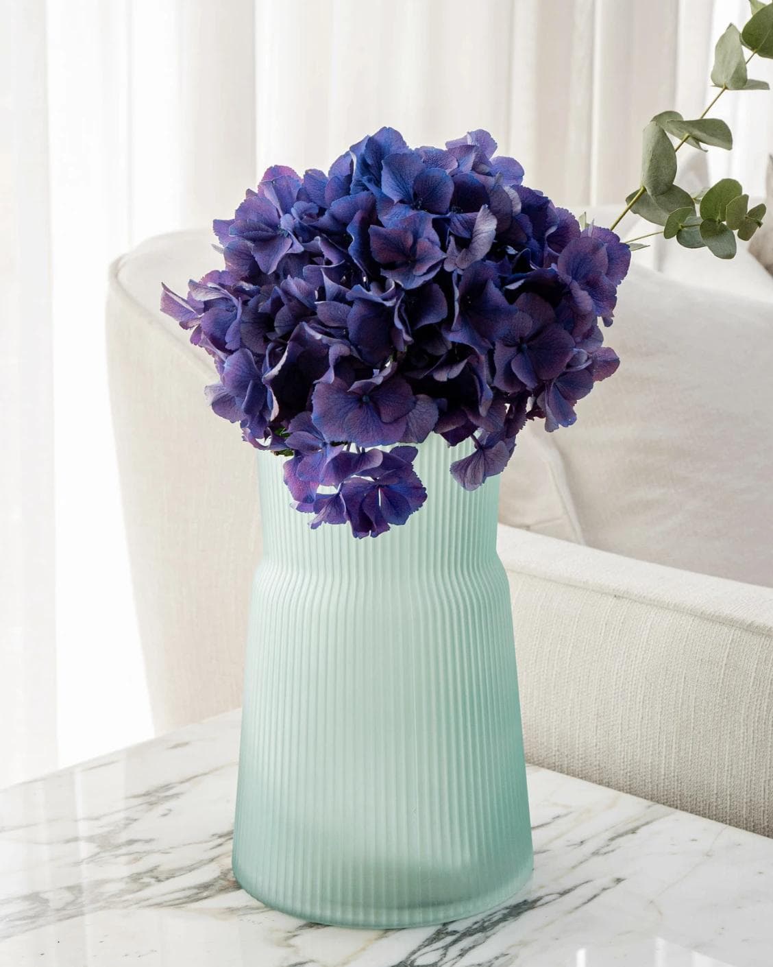 Cloris Storms vases in turquoise, shown in a lifestyle front view as image 5