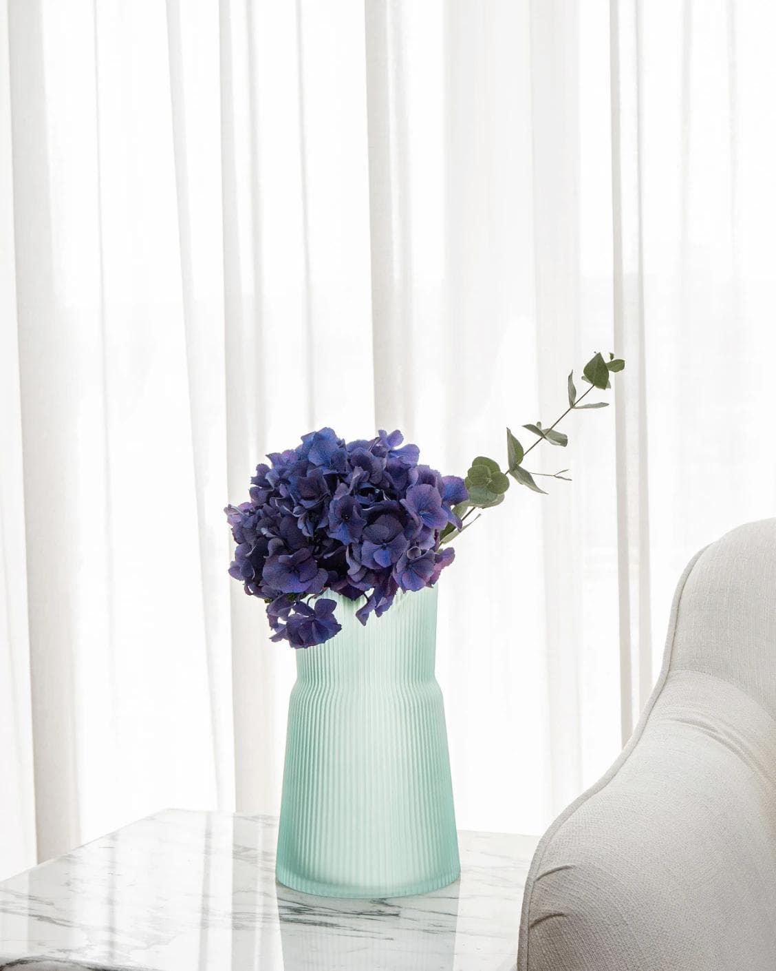Cloris Storms vases in turquoise, shown in a lifestyle right view as image 6