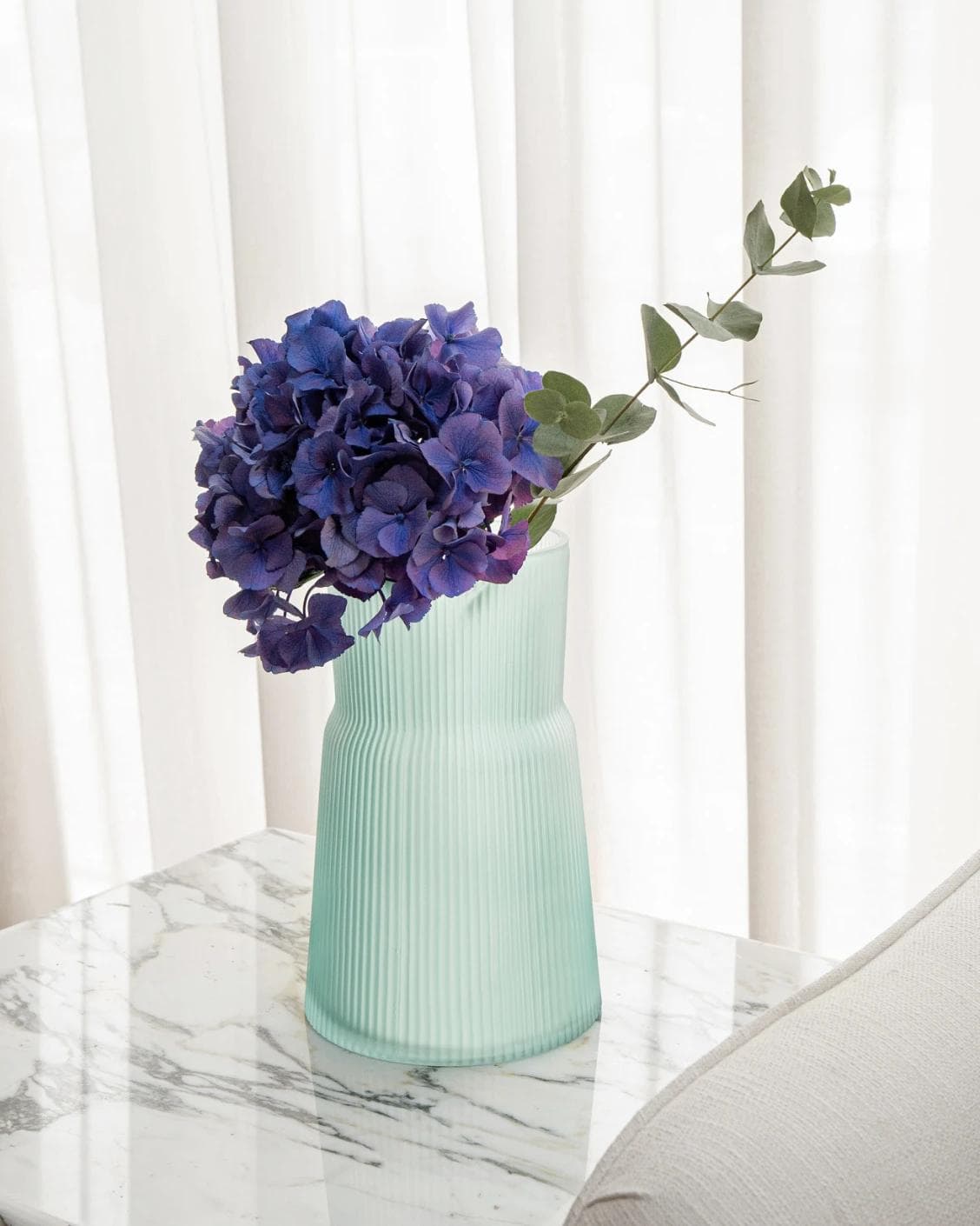 Cloris Storms vases in turquoise, shown in a lifestyle right view as image 2