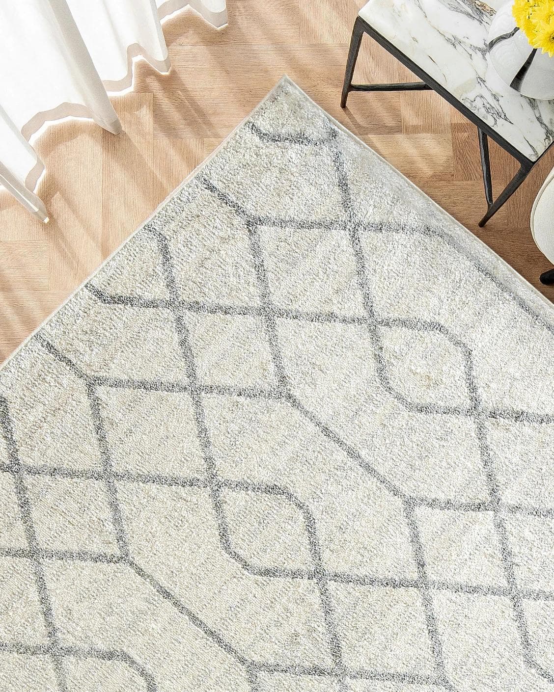 Conrad Lily carpet in ivory and grey, shown in a lifestyle top view as image 2