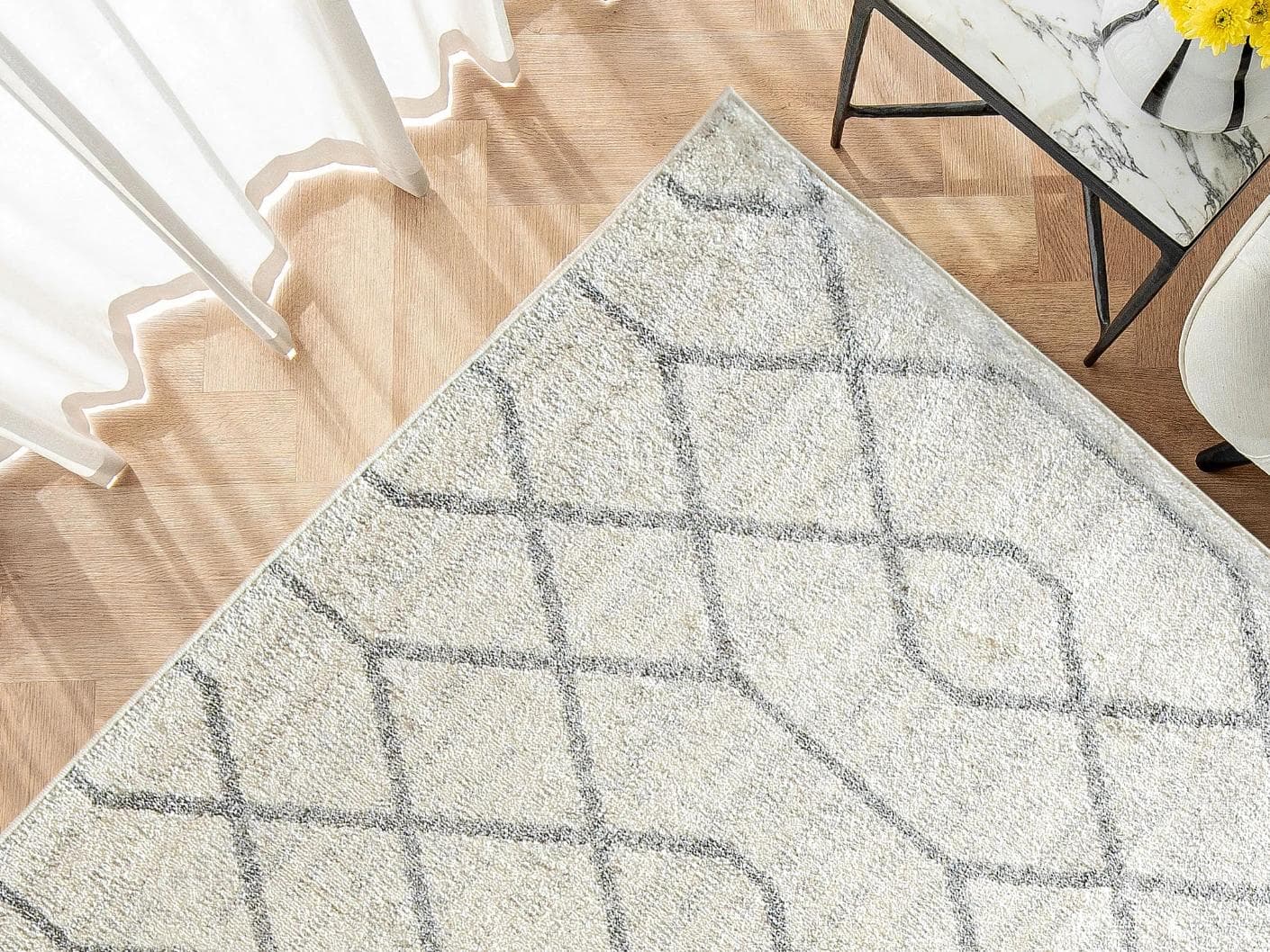 Conrad Lily carpet in ivory and grey, shown in a lifestyle top view as image 2