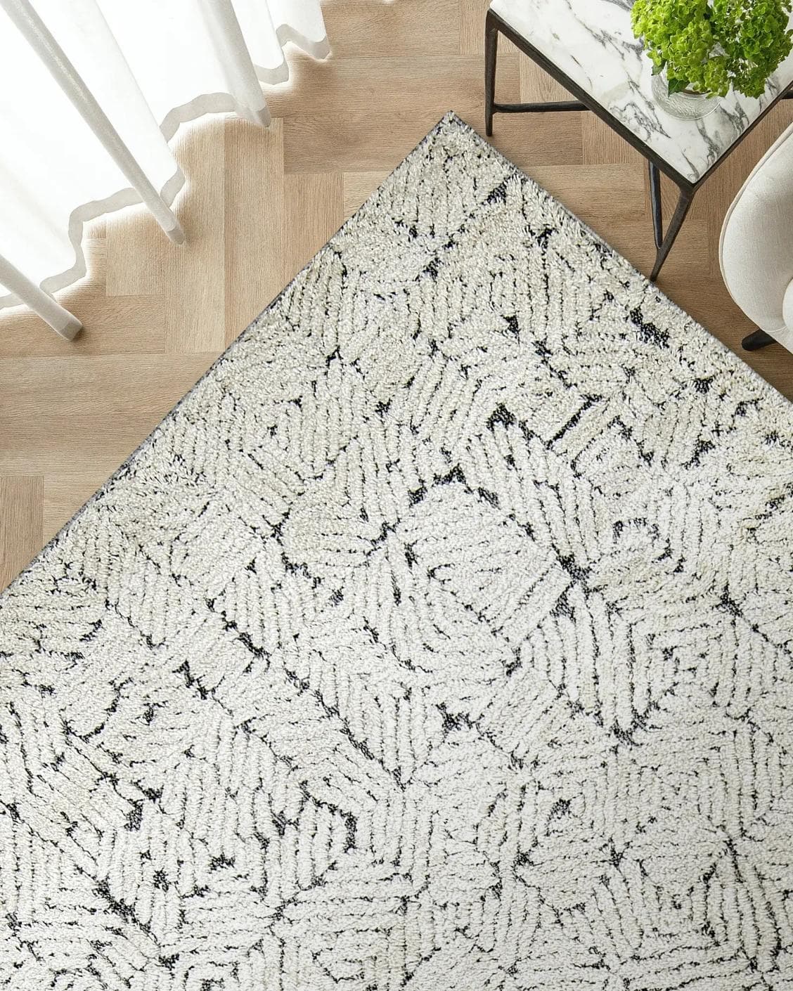 Conrad Sandy carpet in beige and grey, shown in a lifestyle top view as image 2