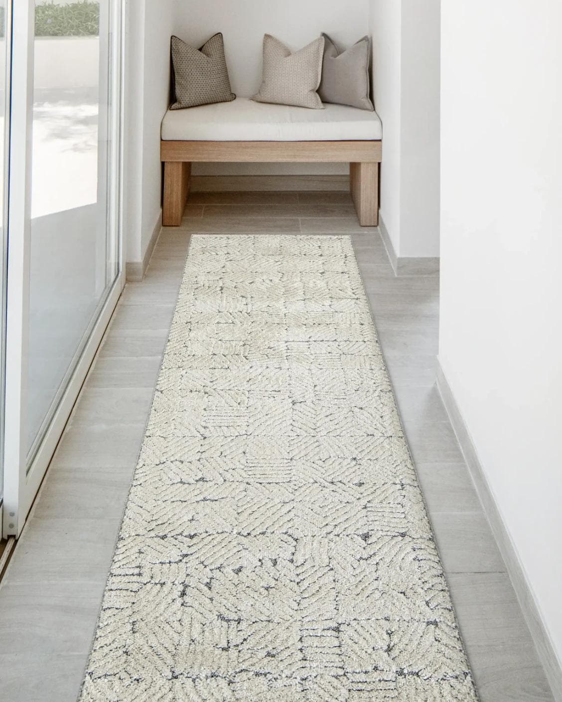 Conrad Sandy Runners carpet in beige and grey, shown in a lifestyle front view