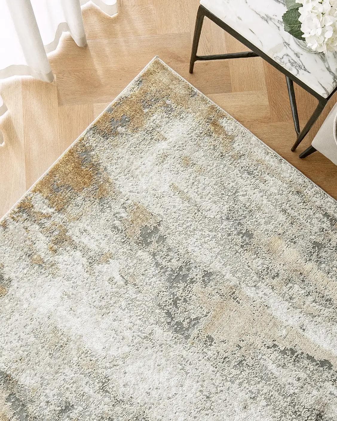 Cooper Goldberg carpet in grey and gold, shown in a lifestyle top view as image 2