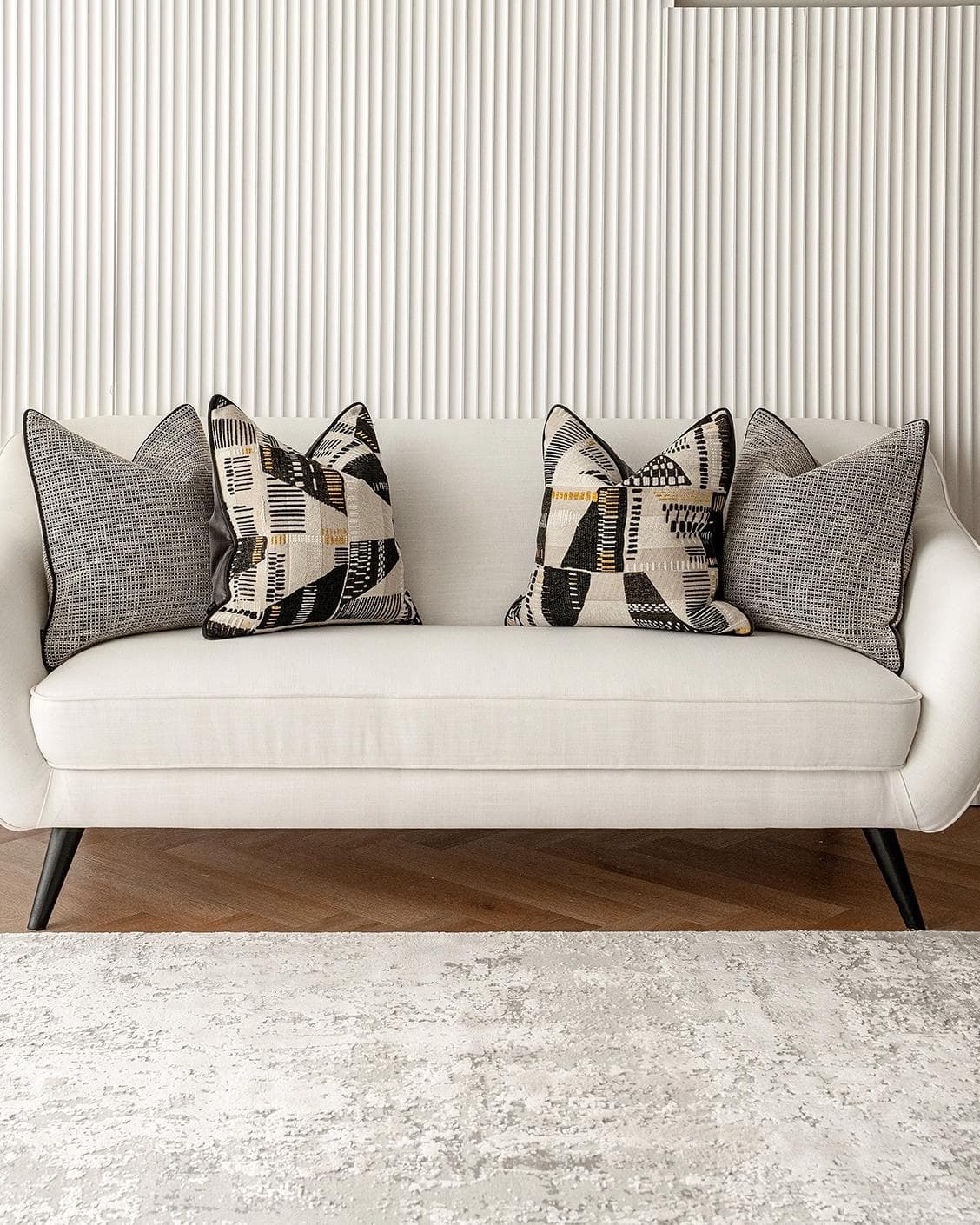 Corbin Bundle cushion in black and beige, shown in a lifestyle front view as image 4