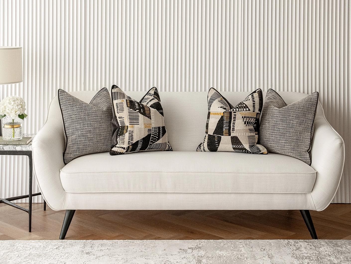 Corbin Bundle cushion in black and beige, shown in a lifestyle front view as image 4