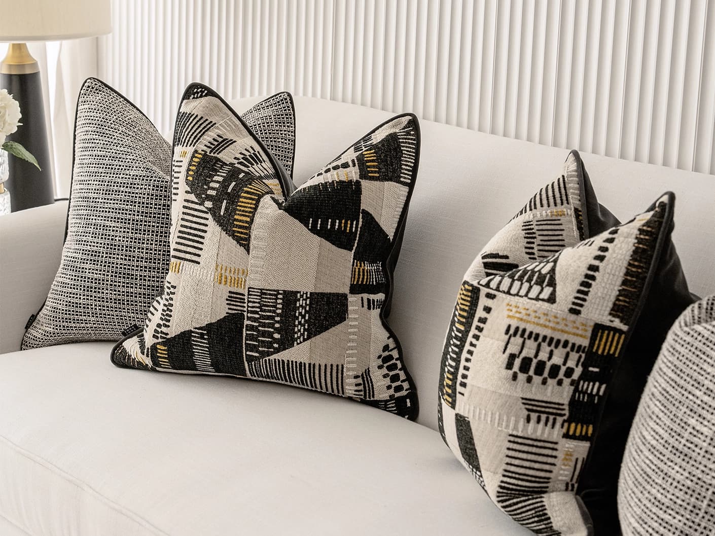 Corbin Bundle cushion in black and beige, shown in a lifestyle right view as image 5