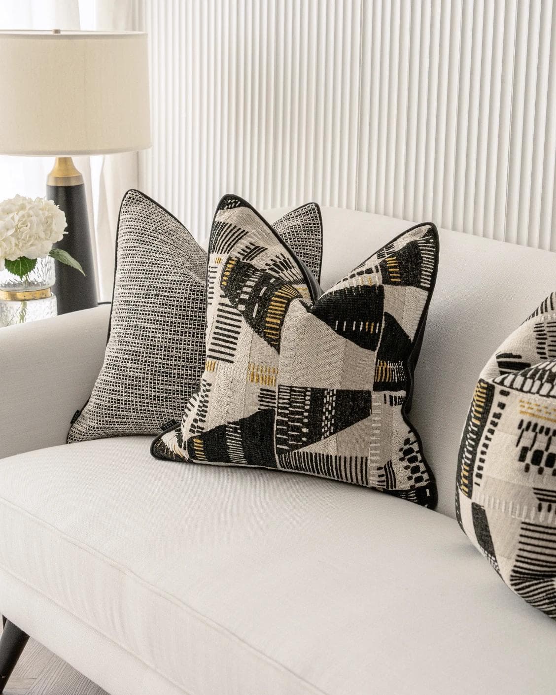 Corbin Bundle cushion in black and beige, shown in a lifestyle right view as image 5