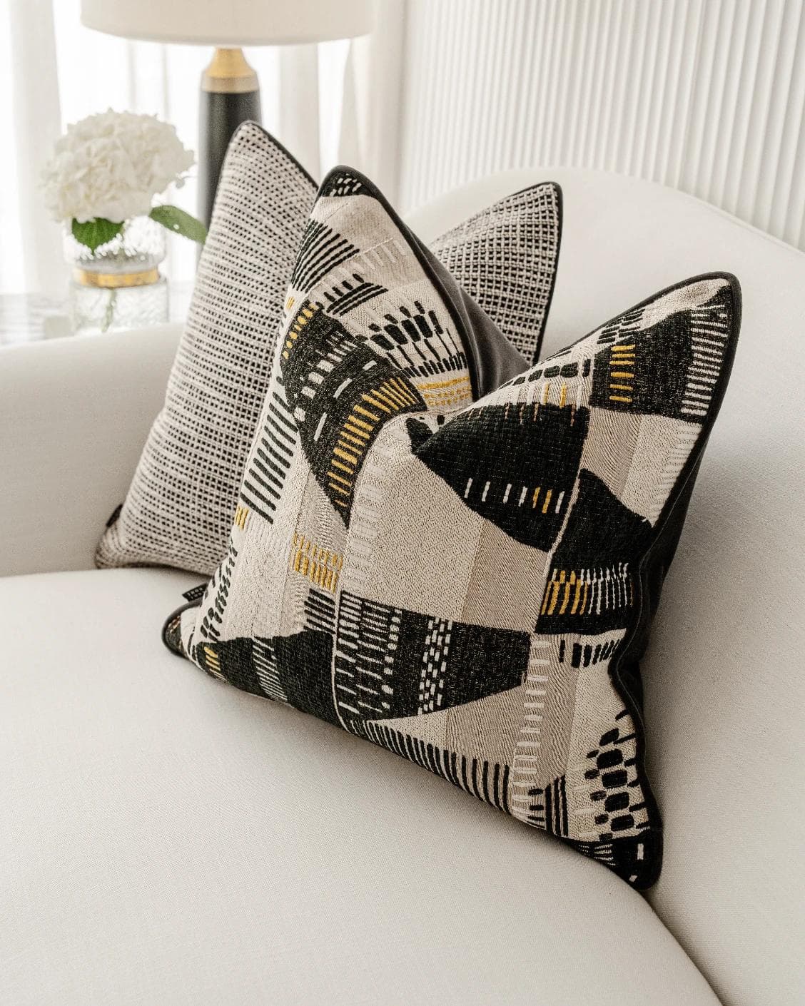 Corbin Bundle cushion in black and beige, shown in a lifestyle right view as image 6