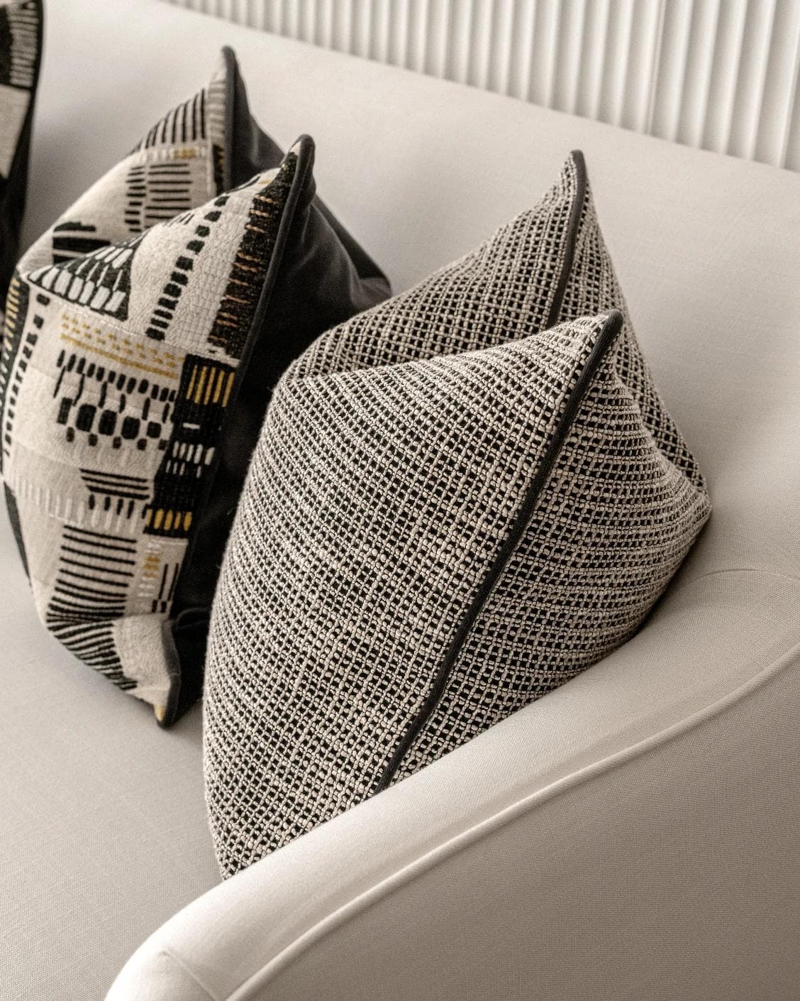 Corbin Bundle cushion in black and beige, shown in a product right view as image 7