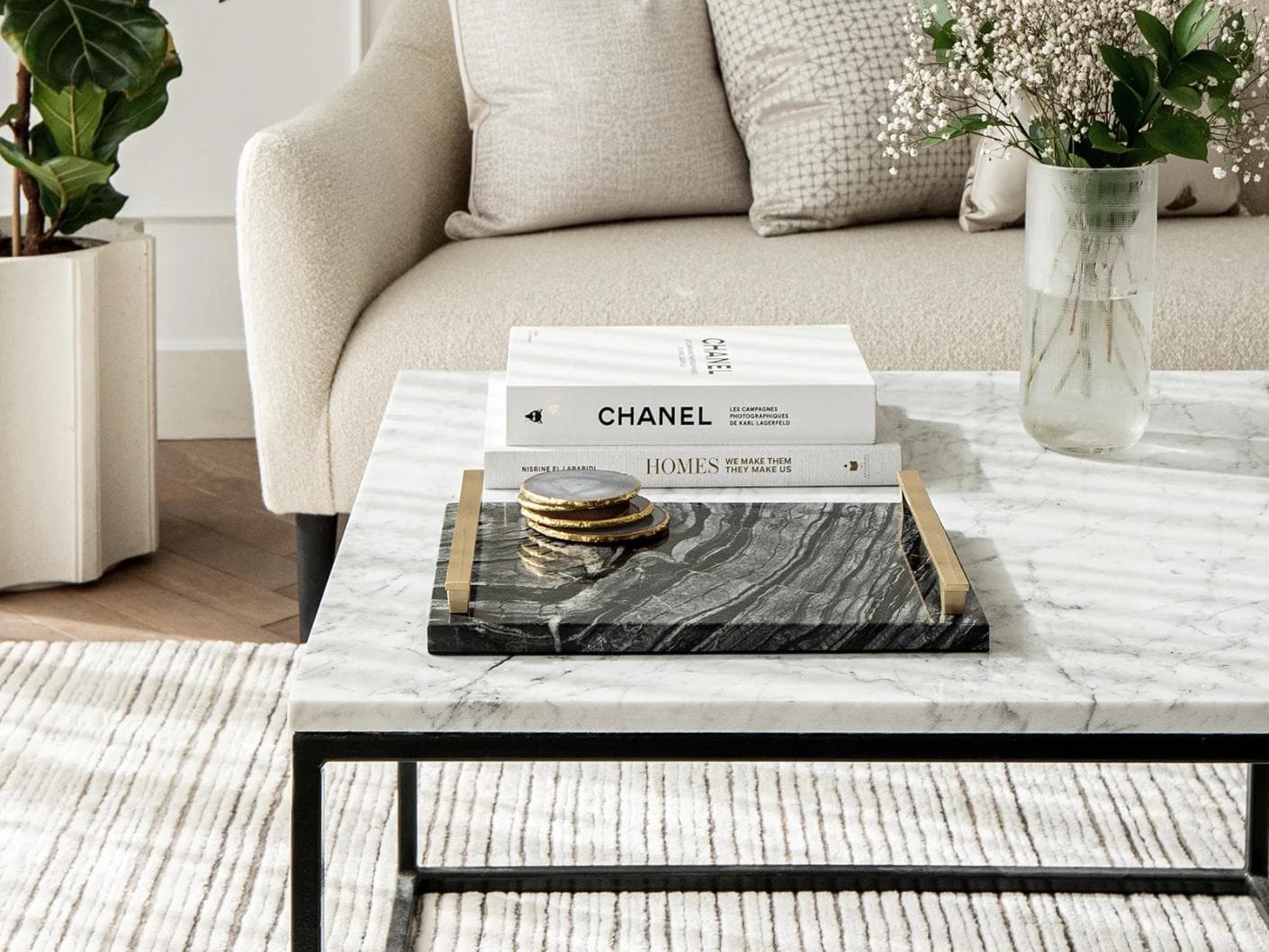Daniel Bandiagara trays in gold and black, shown in a lifestyle front view as image 1